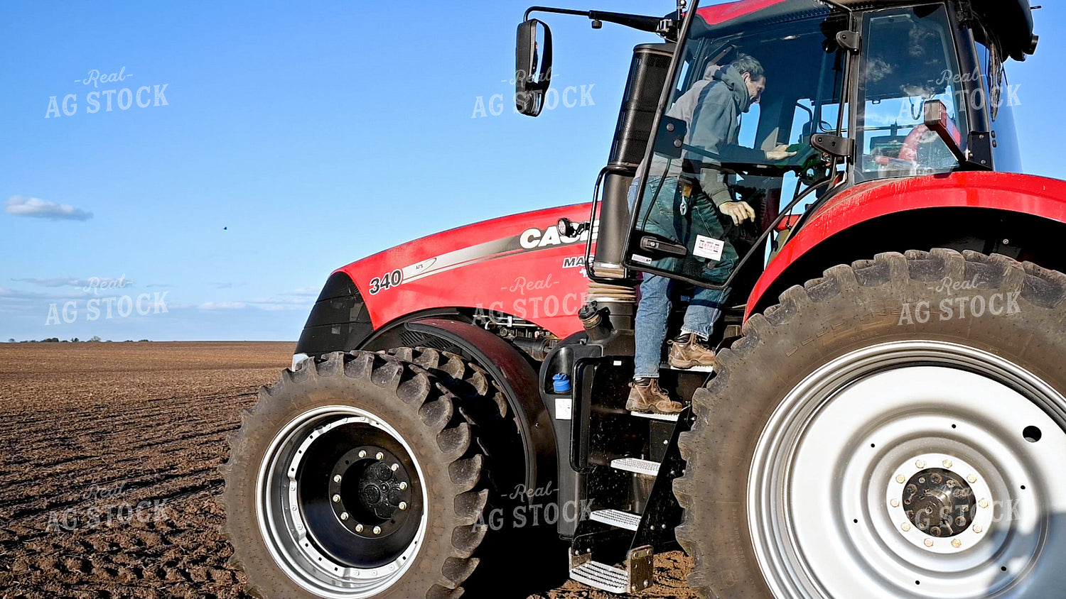 Farmer Climbing into Cab 25225