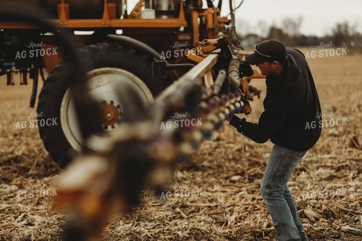Farmer Checking Sprayer Valves 3643
