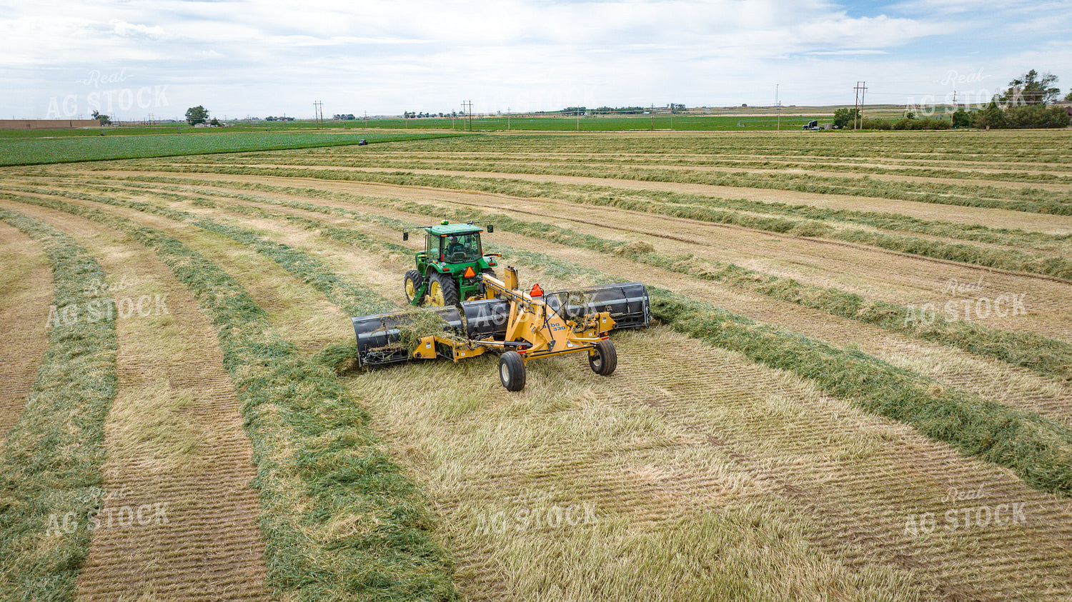 Tractor with Merger in Hay Field 56413