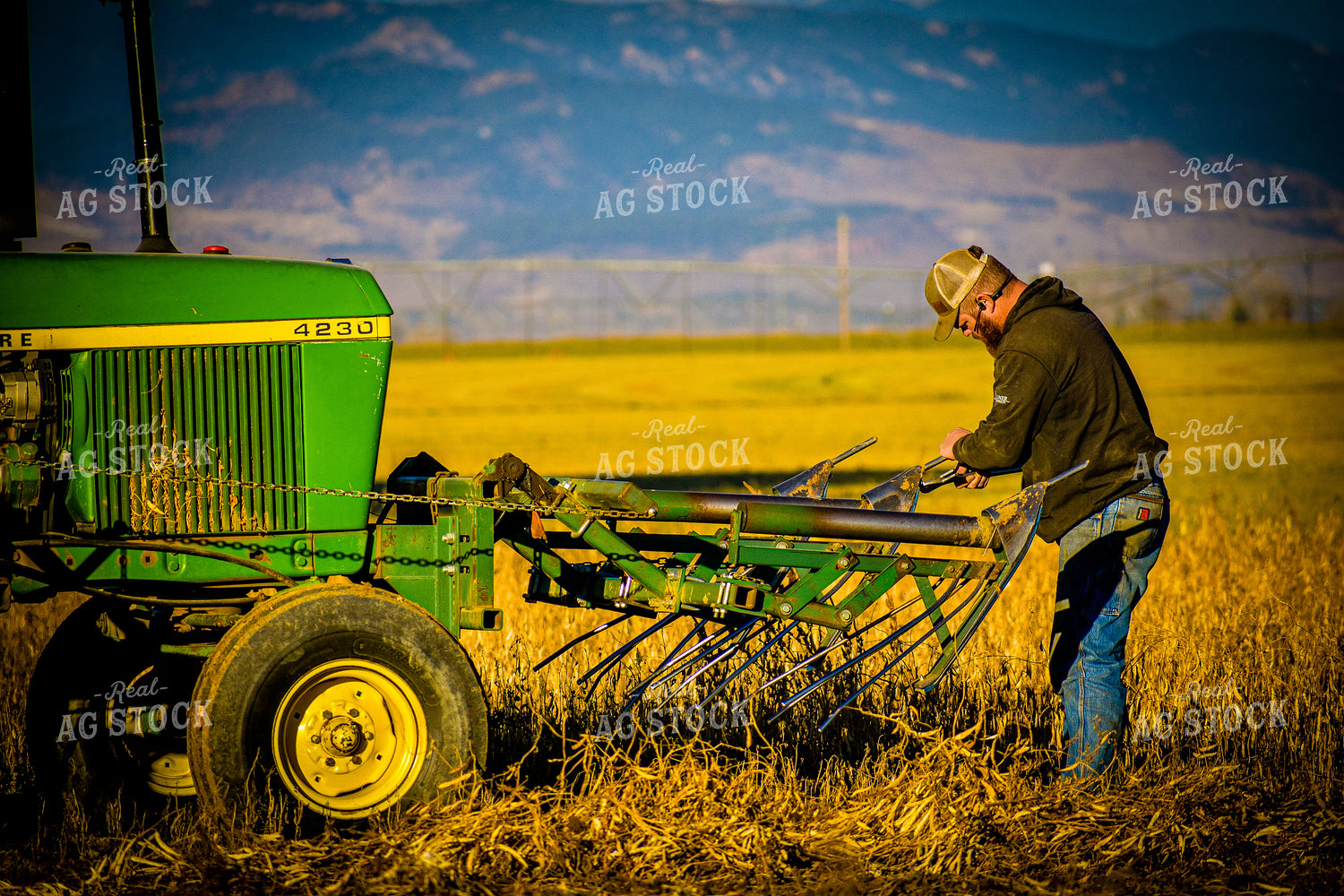 Farmer Working on Machinery 148016