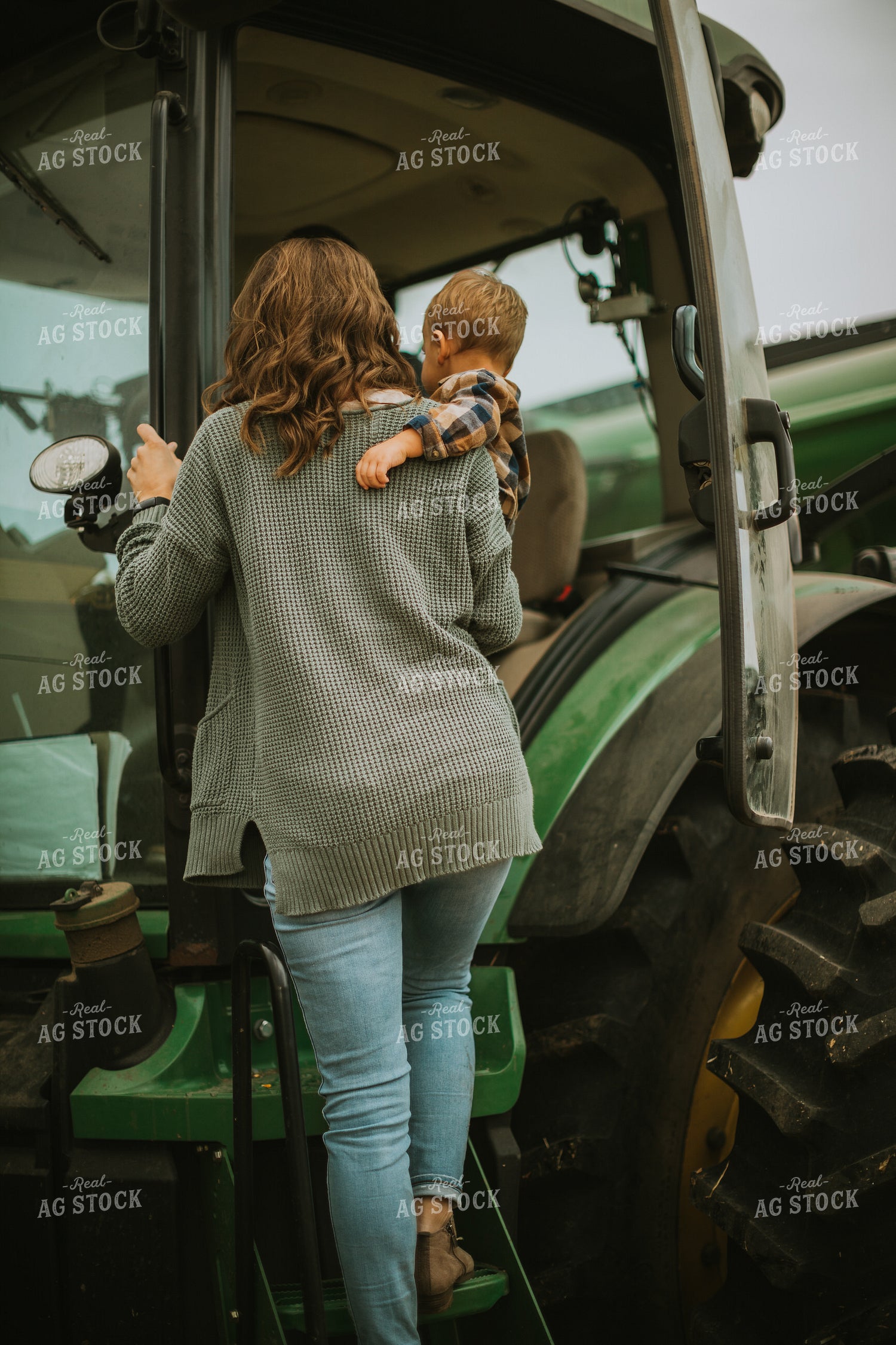 Farmer and Farm Kid Getting into Tractor 6665