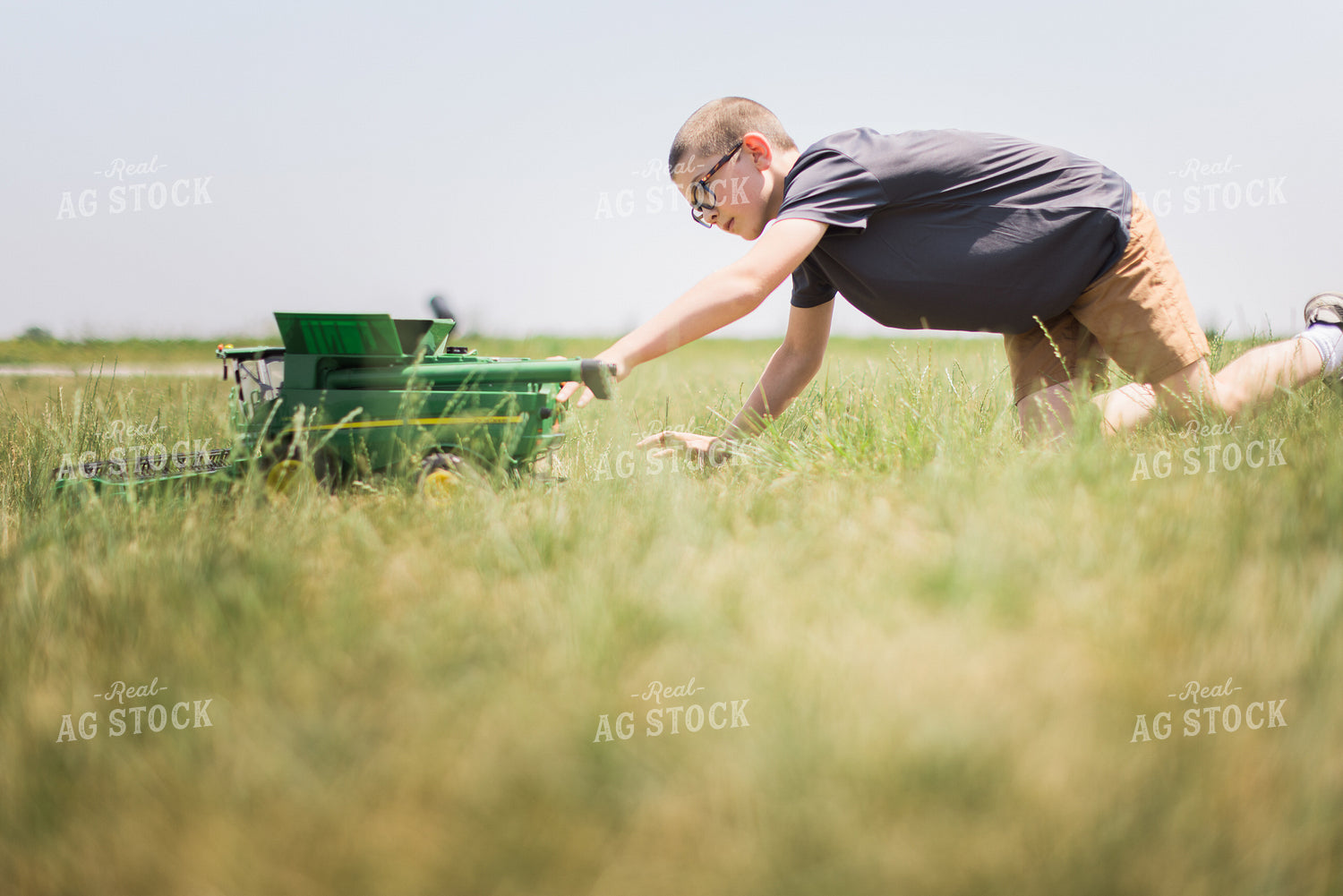 Farn Kid Plays with Toy Combine 8093
