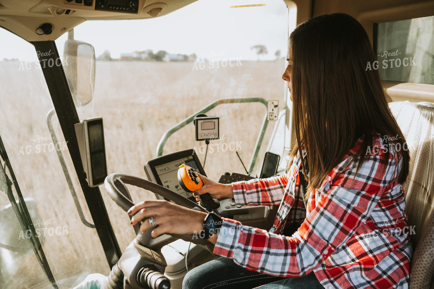 Female Farmer Driving Combine 3493