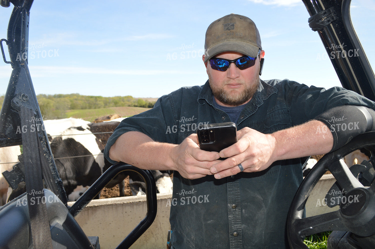 Farmer on Phone on Side by Side 206007