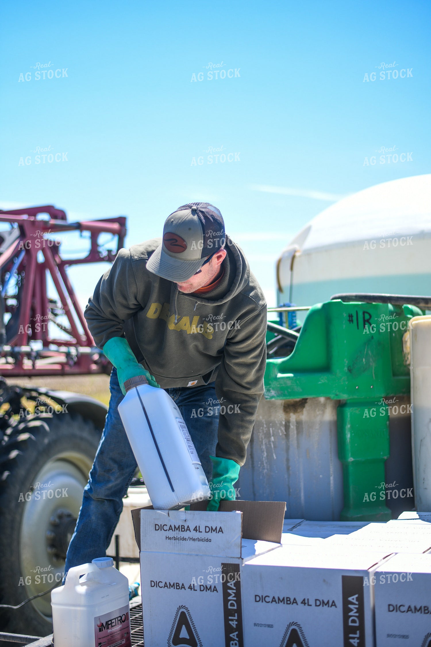 Farmer Mixing Chemicals for Self Propelled Sprayer 191061