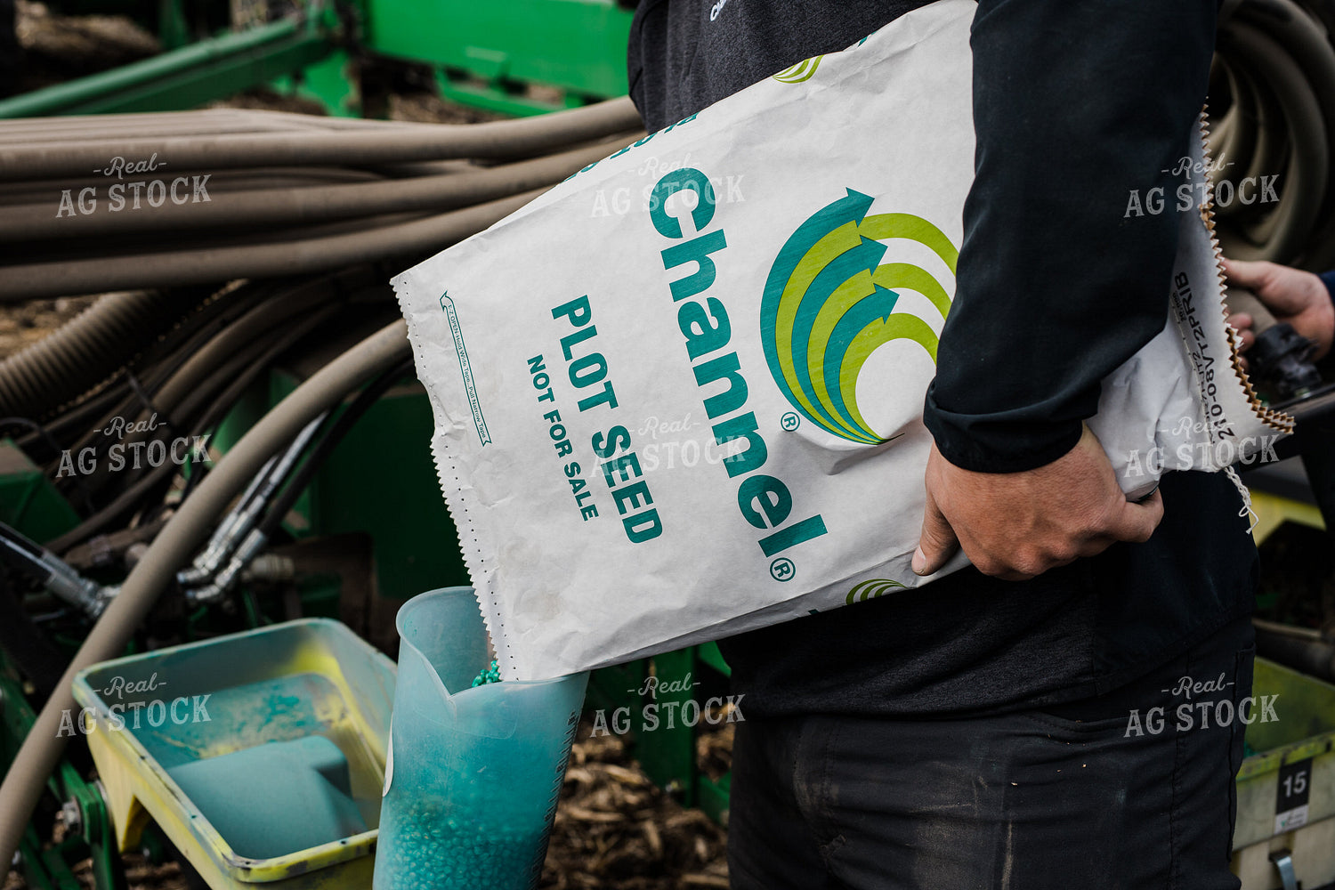 Farmers Pours Seed into Planter 133009