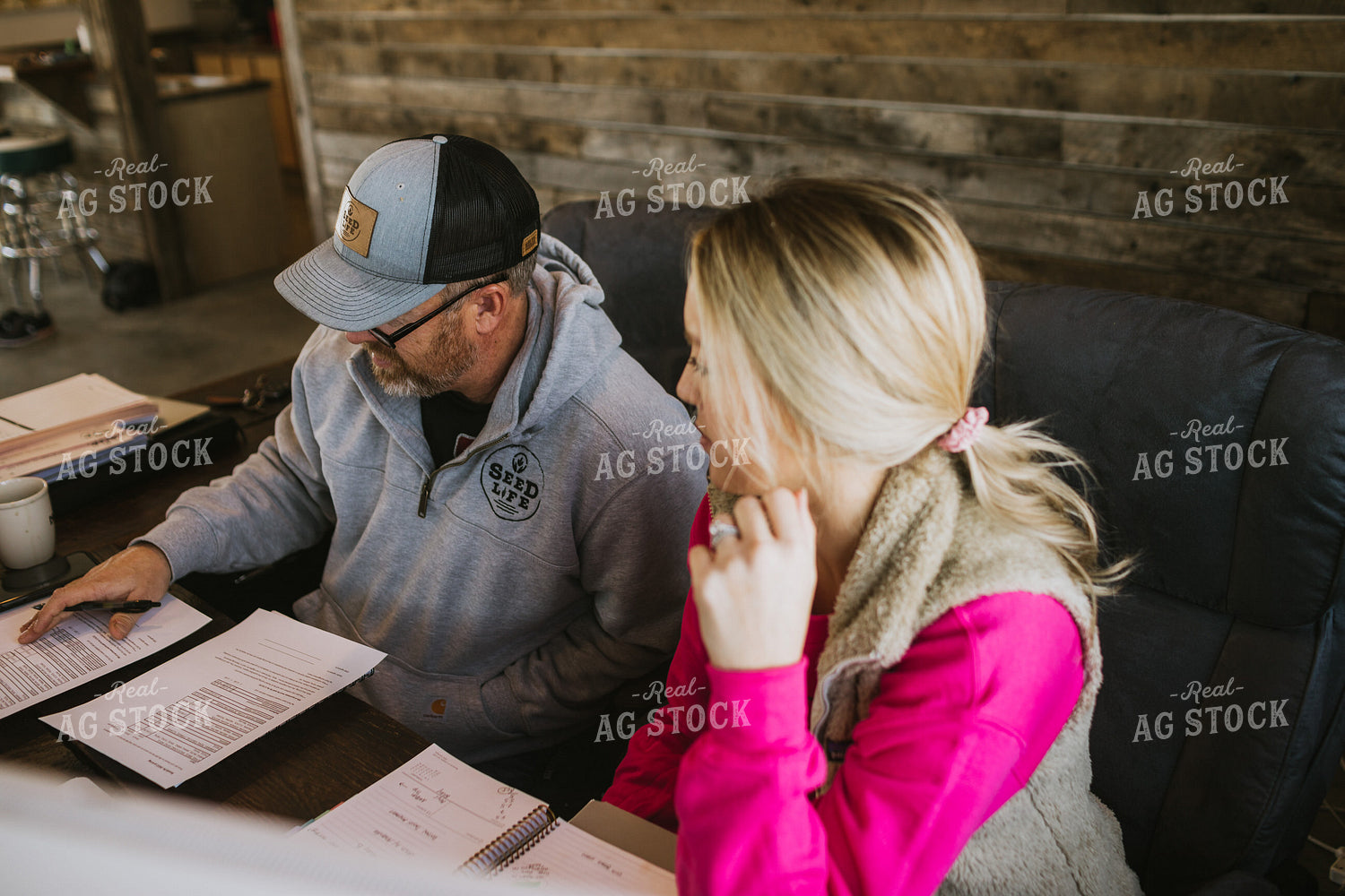 Man and Woman Going Over Paperwork 5342