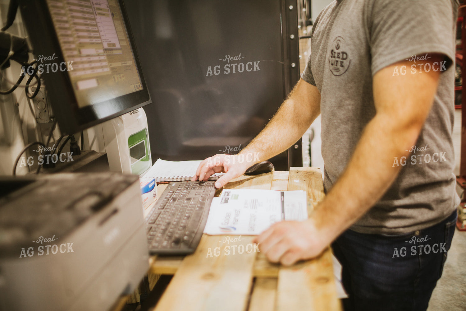 Man Running Seed Treater with Computer 5326