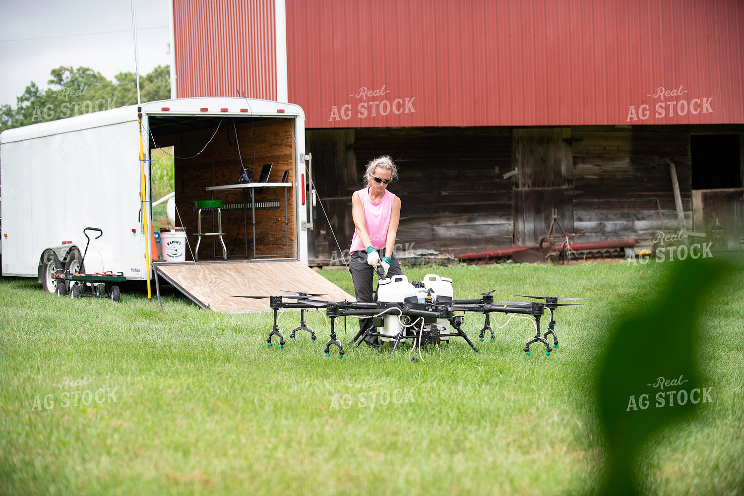 Female Pilot Preparing Drone for Fungicide Application 168071