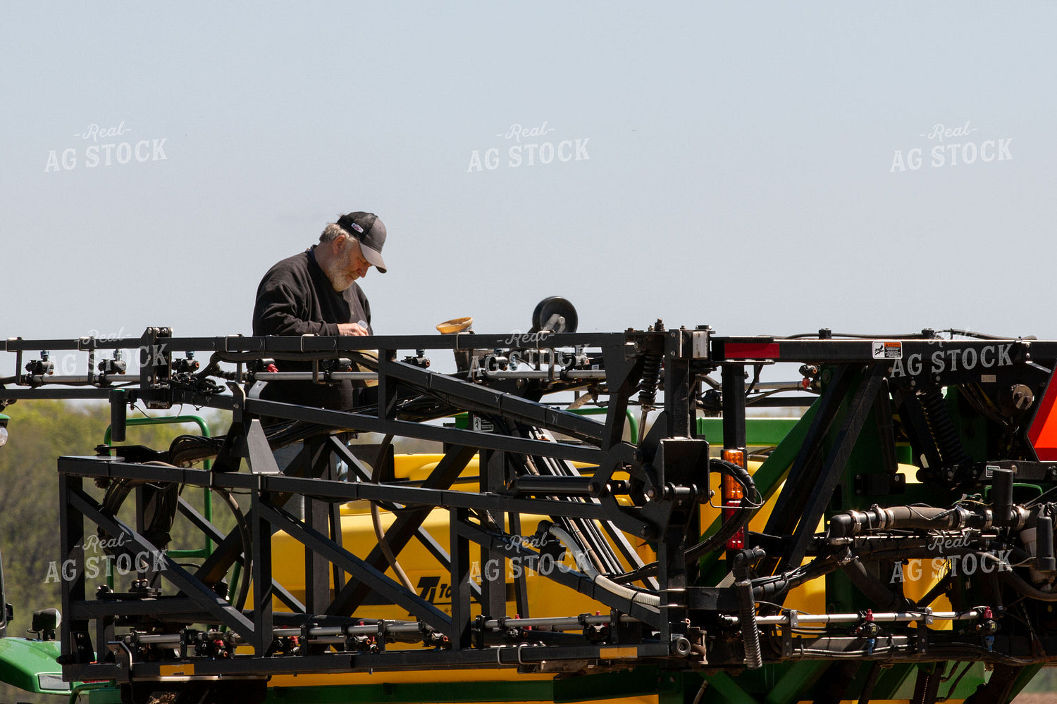 Farmer Fixing Sprayer 157131