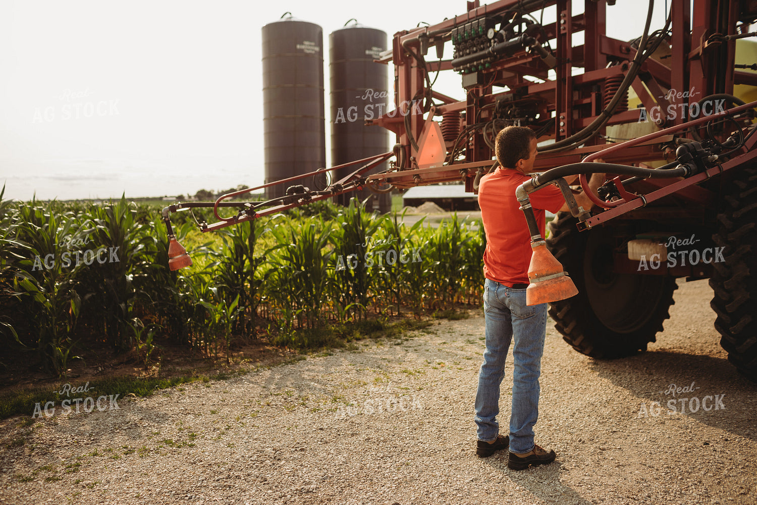 Farmer Checking Sprayer Nozzles 4447