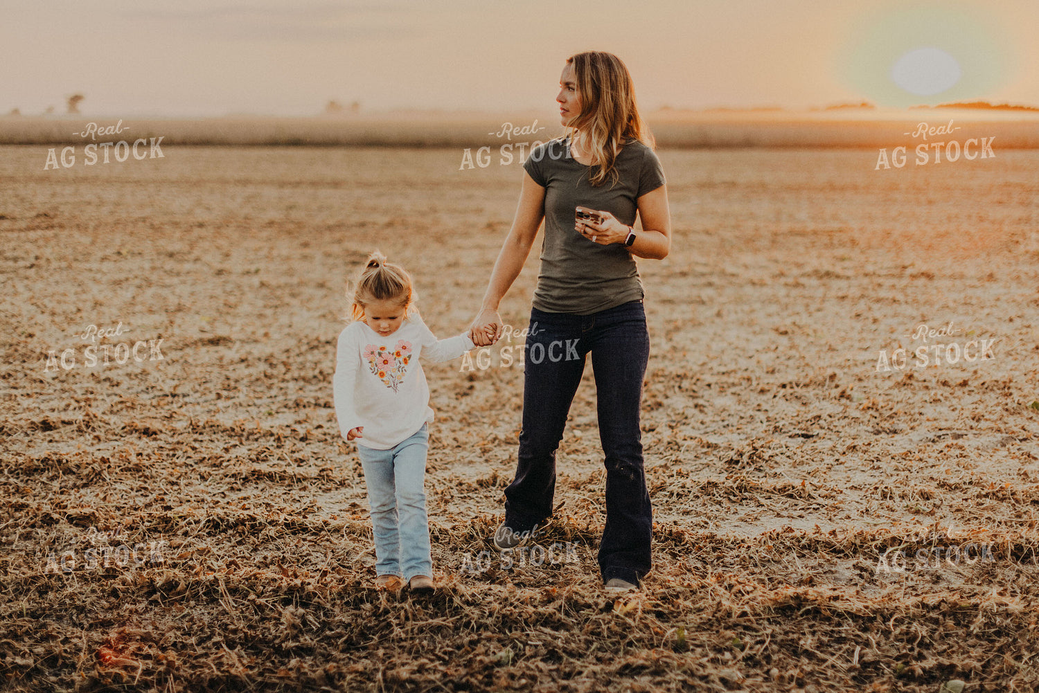 Farm Wife Walking with Daugher in Field 9271