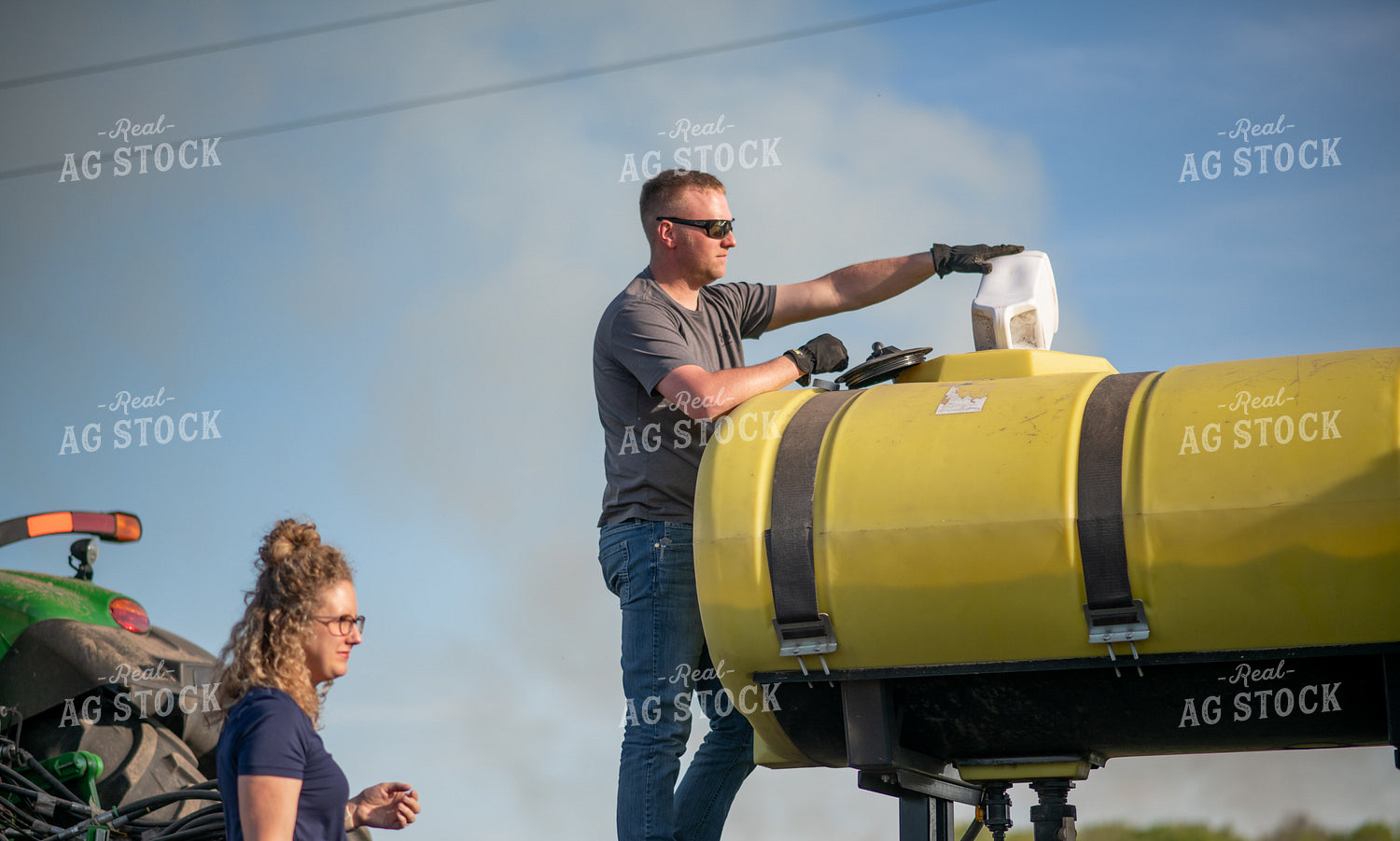 Farmer Filling Planter with Starter 76370
