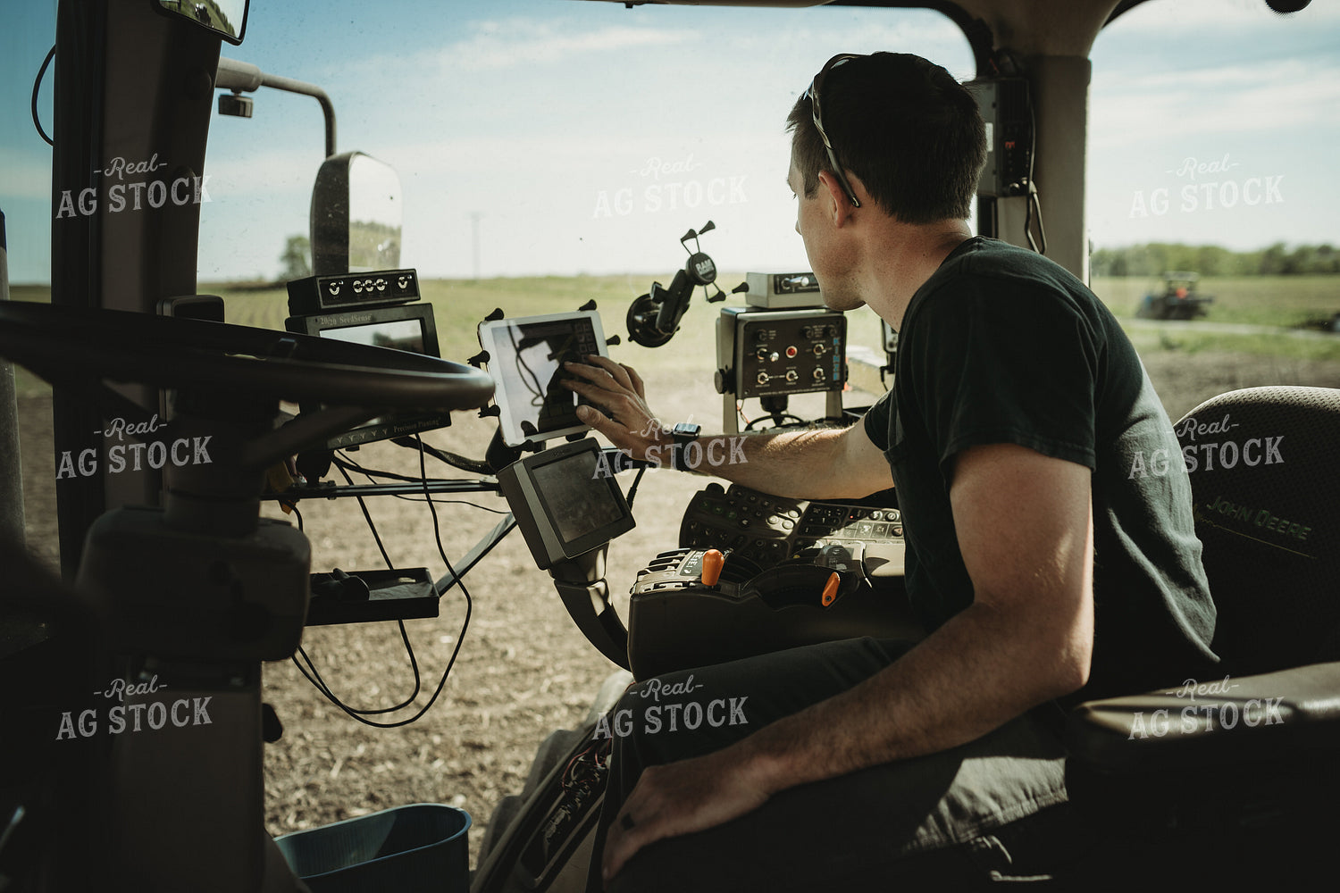 Farmer Adjusting Planter Monitor 4113