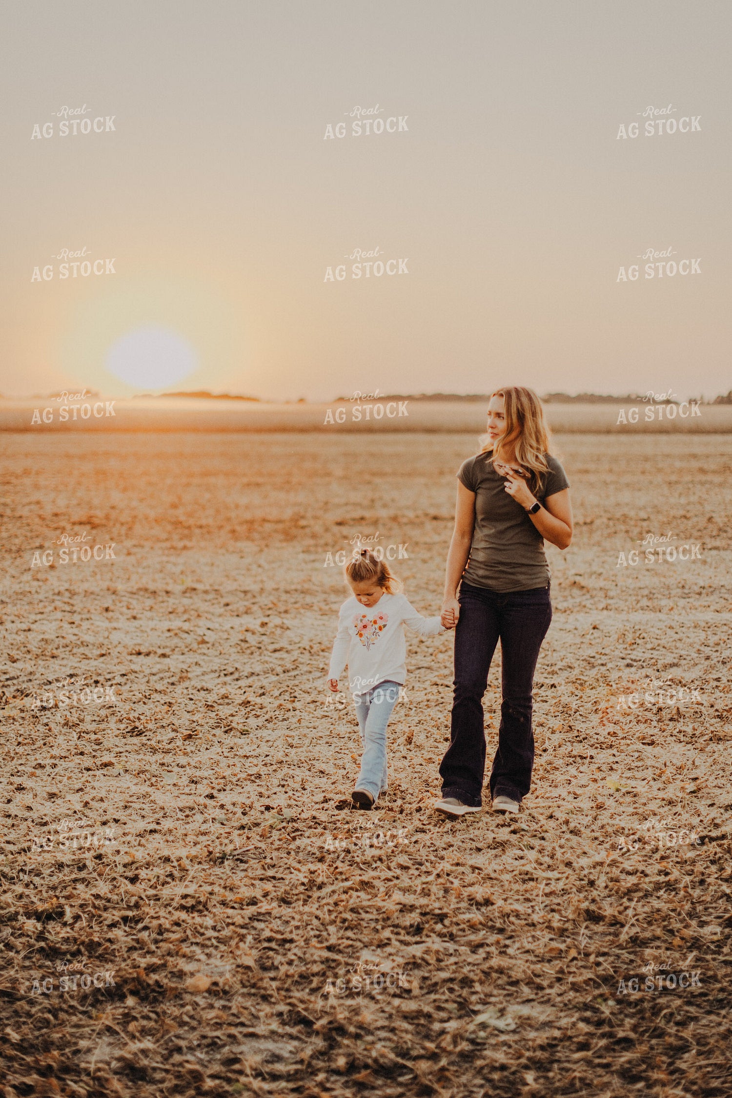 Farm Wife Walking with Daugher in Field 9272