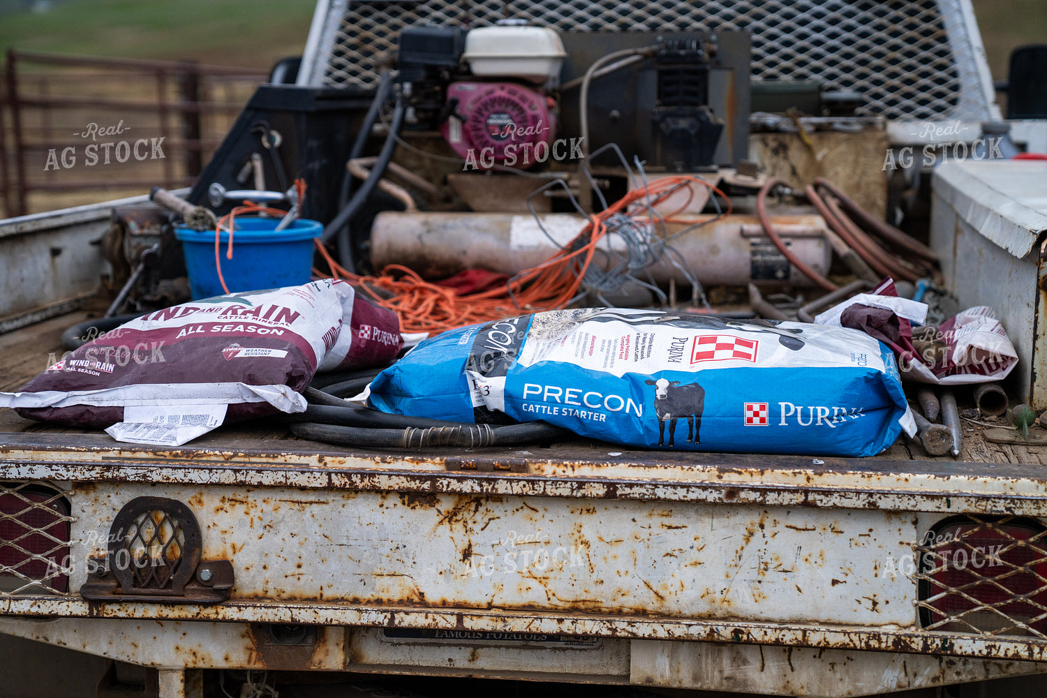Close-Up of Ranch Supplies and Feed Bags on a Rusty Truck Bed 65276