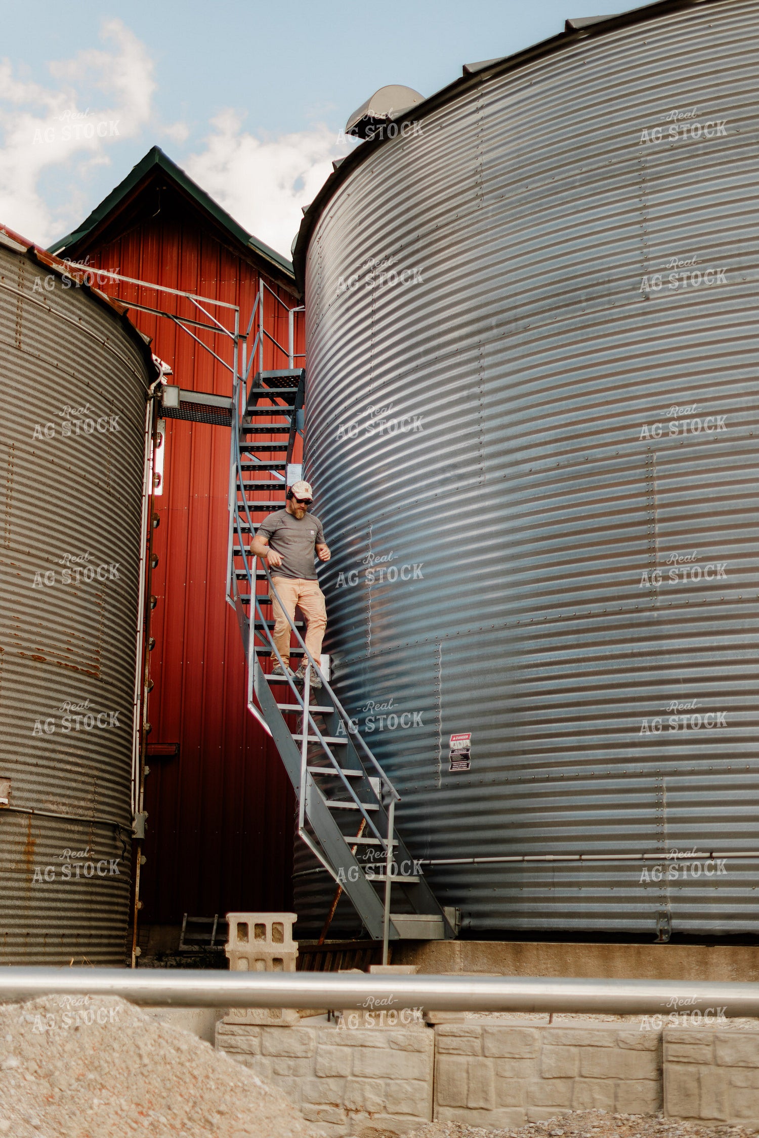 Farmer Climbing Down Grain Bin 9343