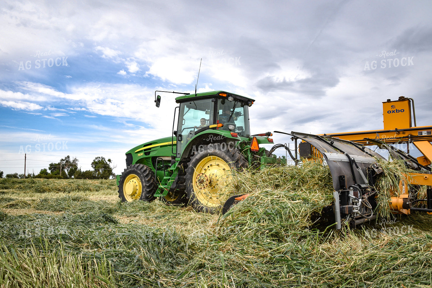 Tractor with Merger in Hay Field 56430