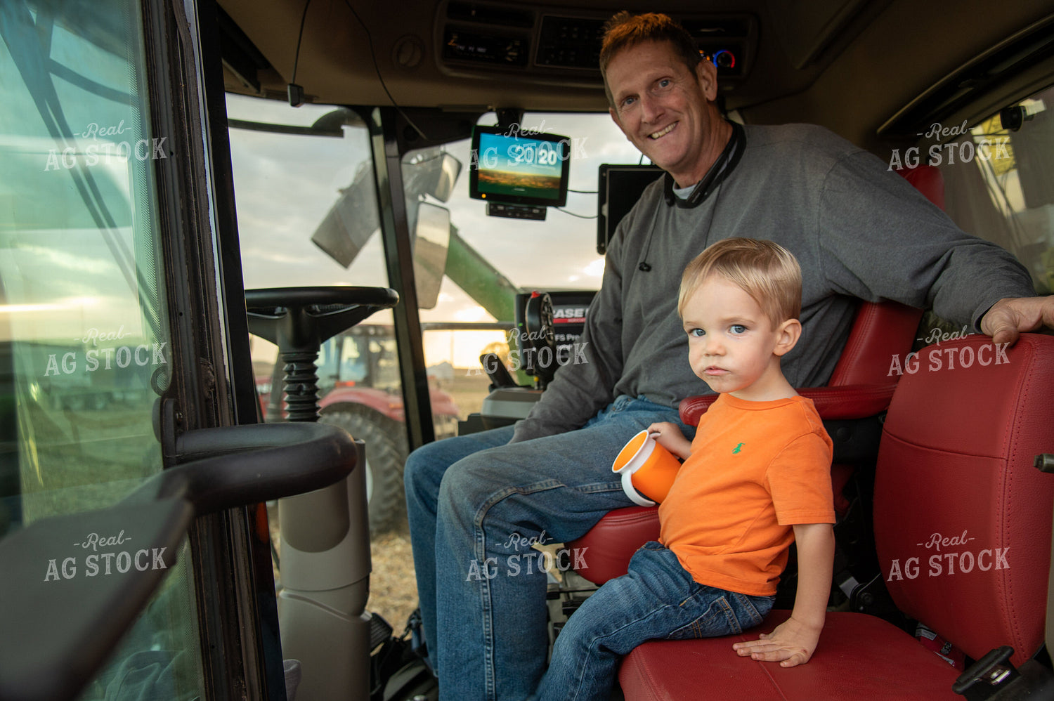 Grandson and Grandfather Farmer in the Combine Cab 25833