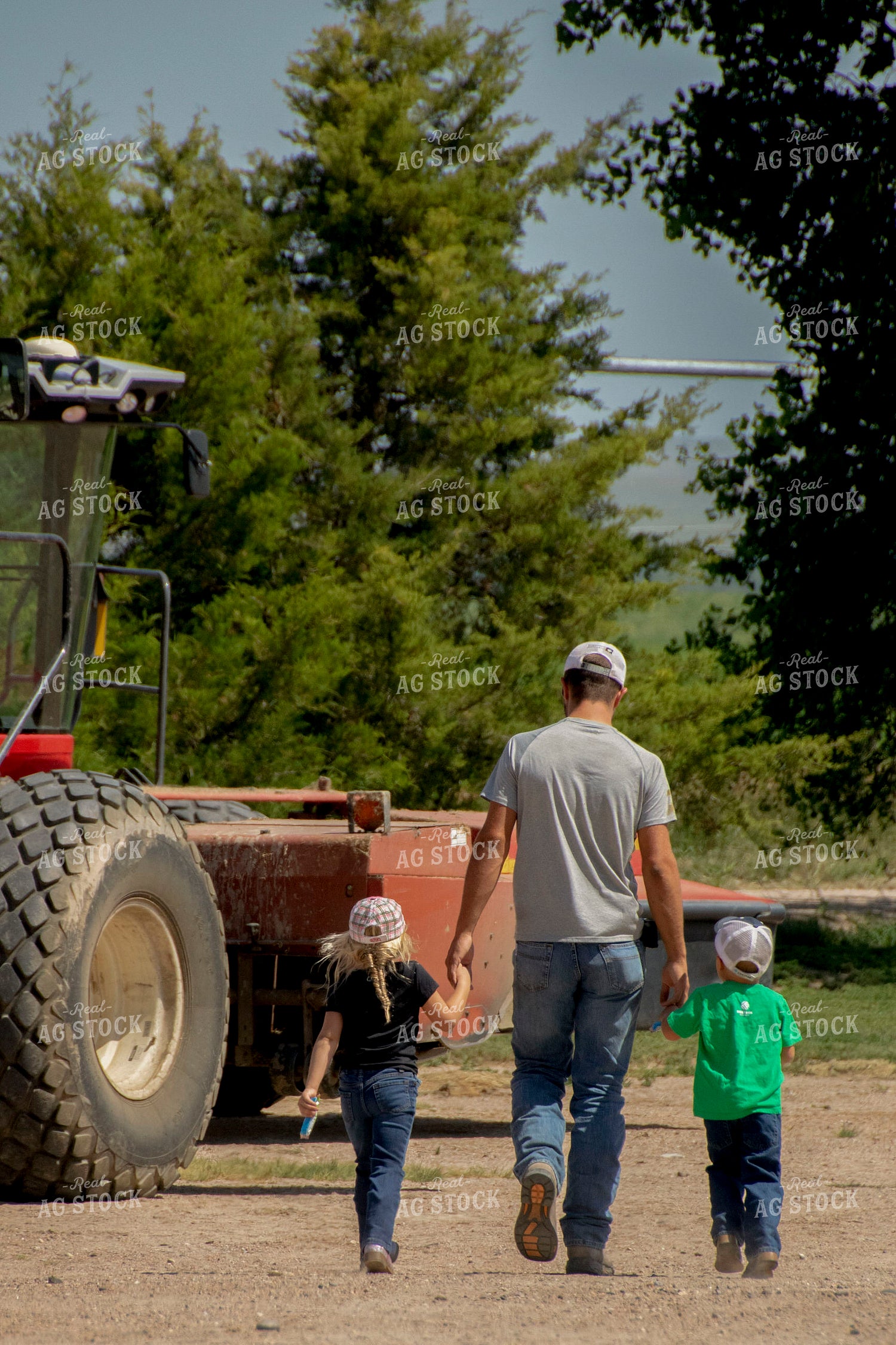 Farmer Walking with Kids in Farmyard 157012