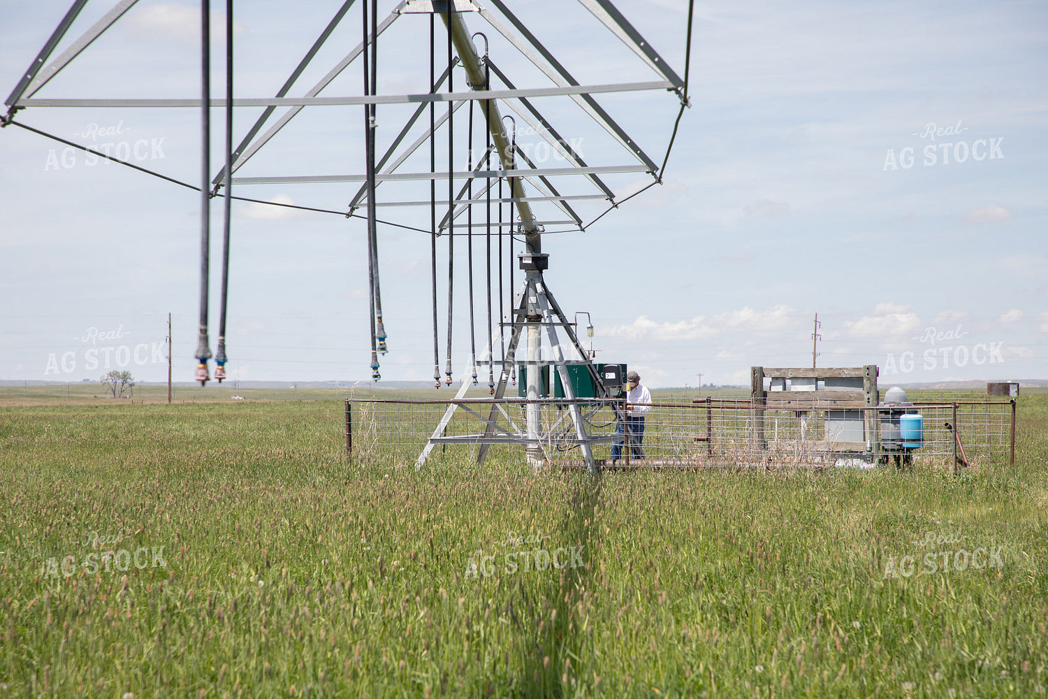Farmer Checking Pivots 117062