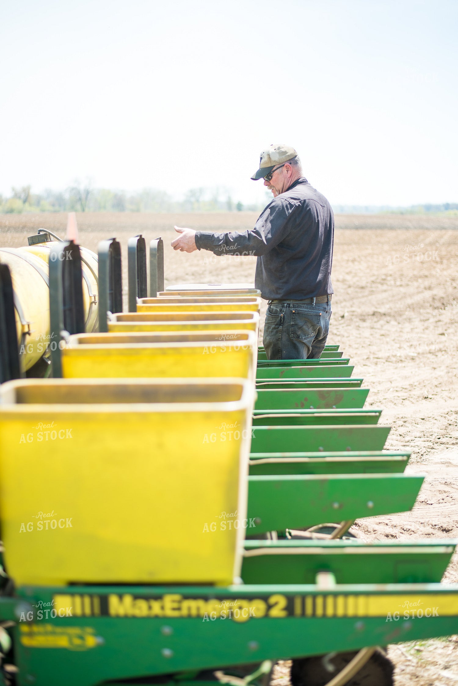 Farmer with Seed Boxes on Planter 74043