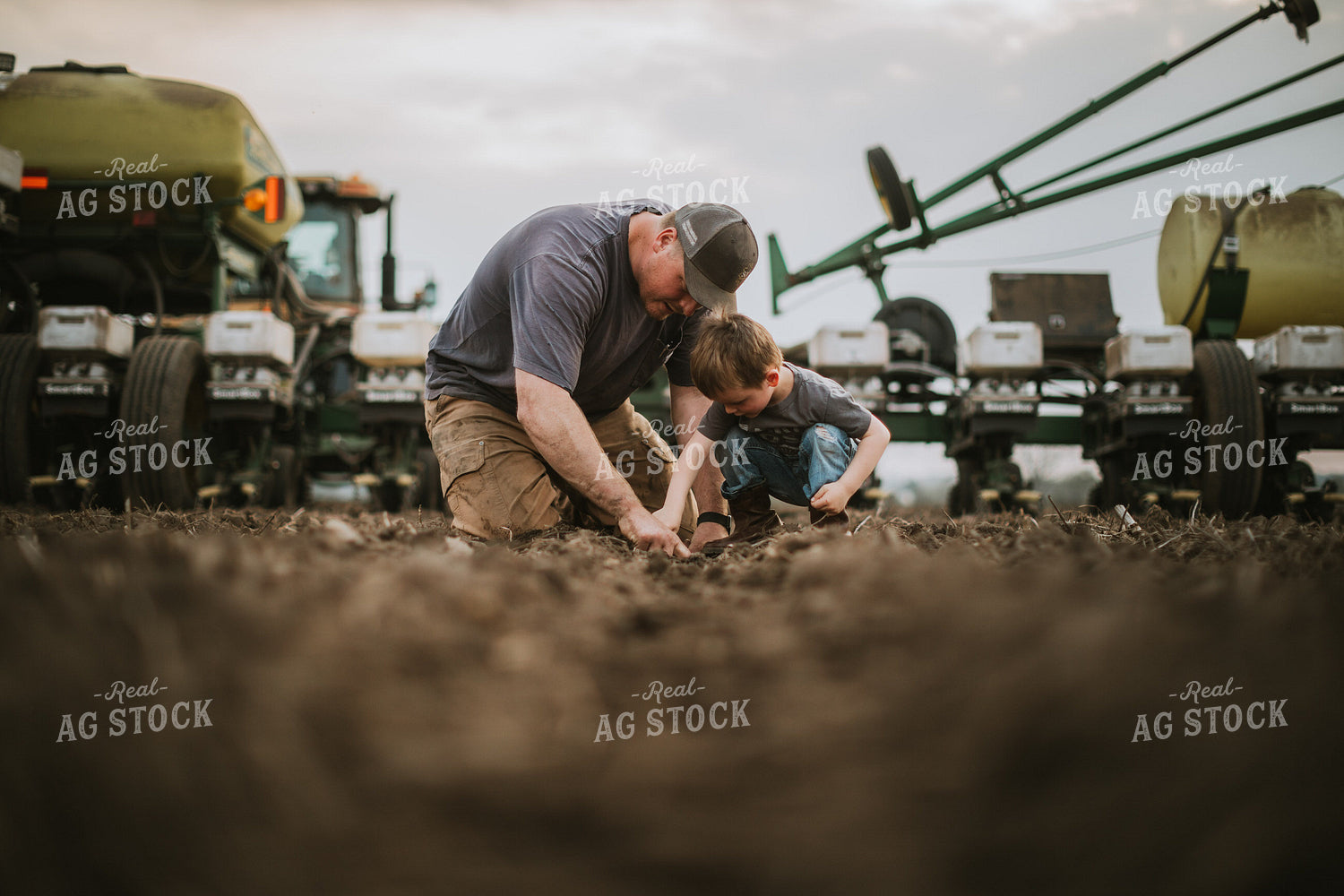 Farmer and Farm Kid Checking Seed Depth 5655