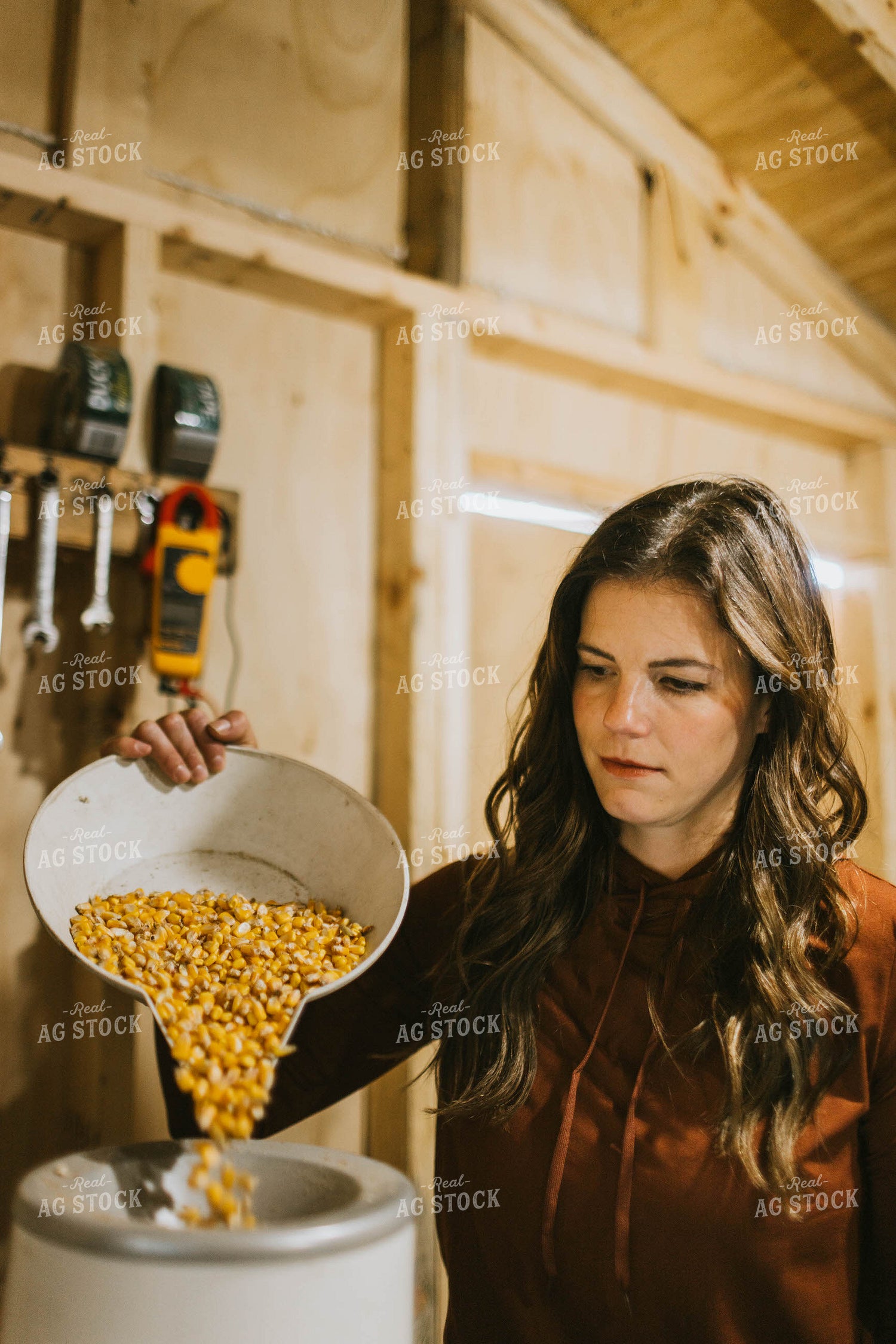 Female Farmer Testing Corn Moisture 8500