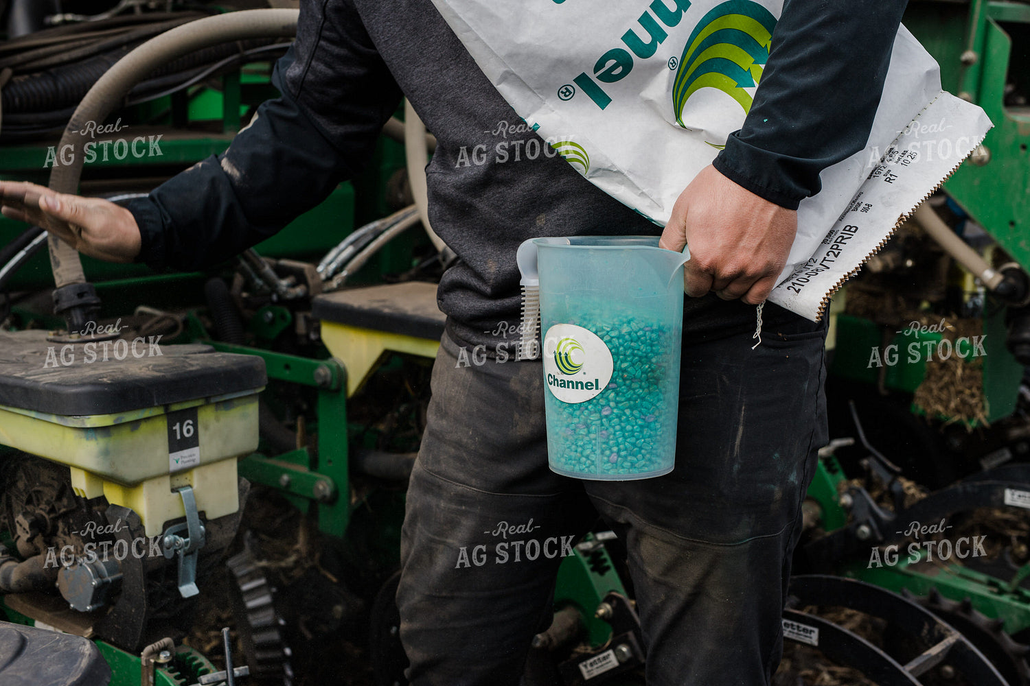 Farmers Pours Seed into Planter 133008