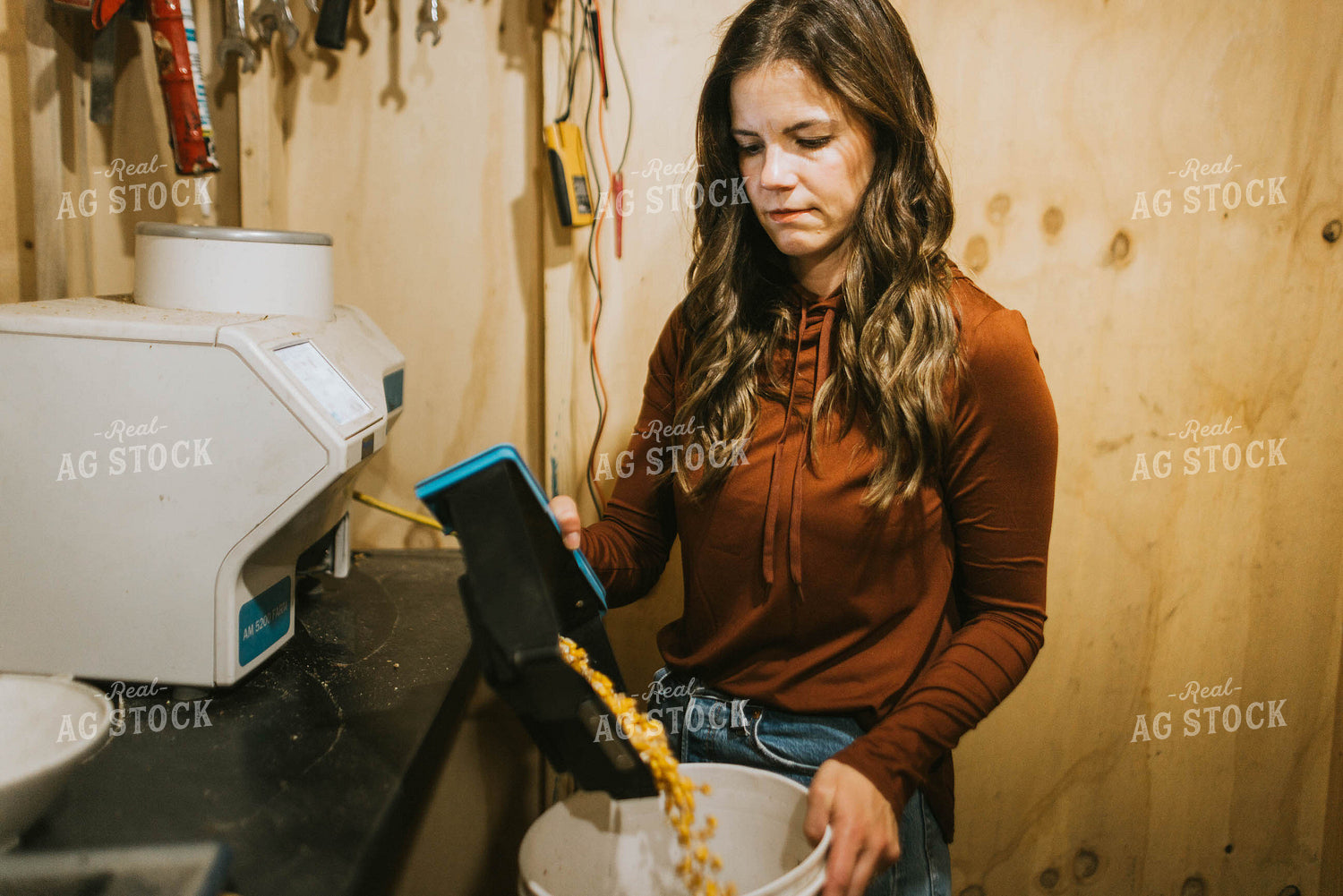 Female Farmer Testing Corn Moisture 8501