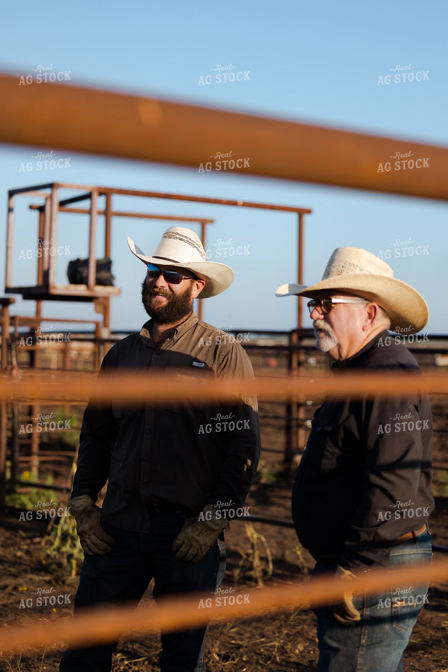 Ranchers Talking by Fence 205074