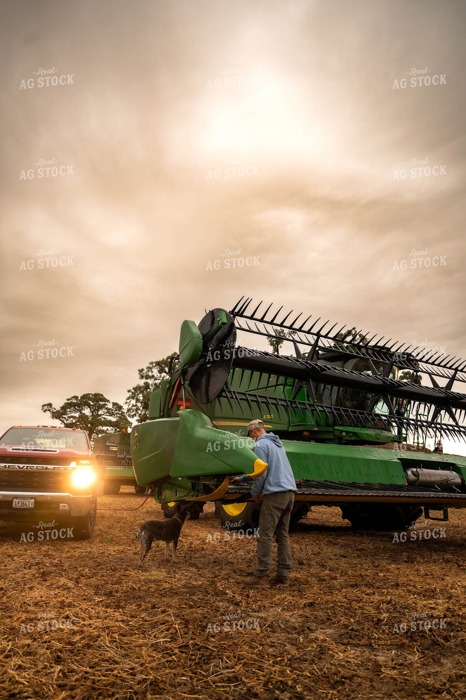 Farmer Fixing Combine Head 115409