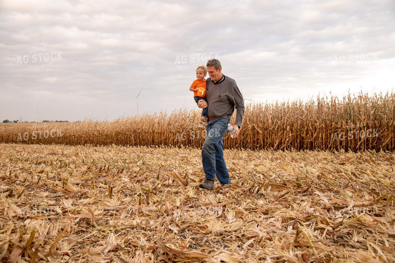 Grandson and Grandfather Farmer in Field 25831