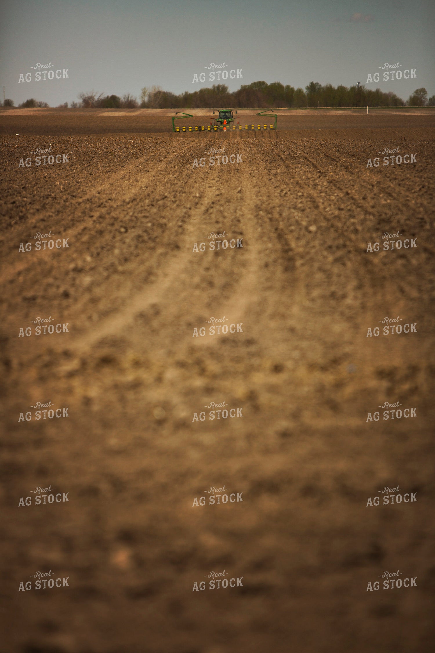 Tractor Pulling Planter in Field 6365