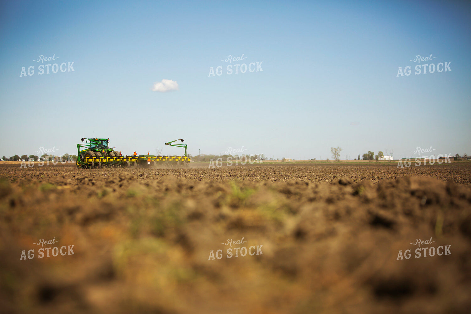 Tractor Pulling Planter in Field 6362