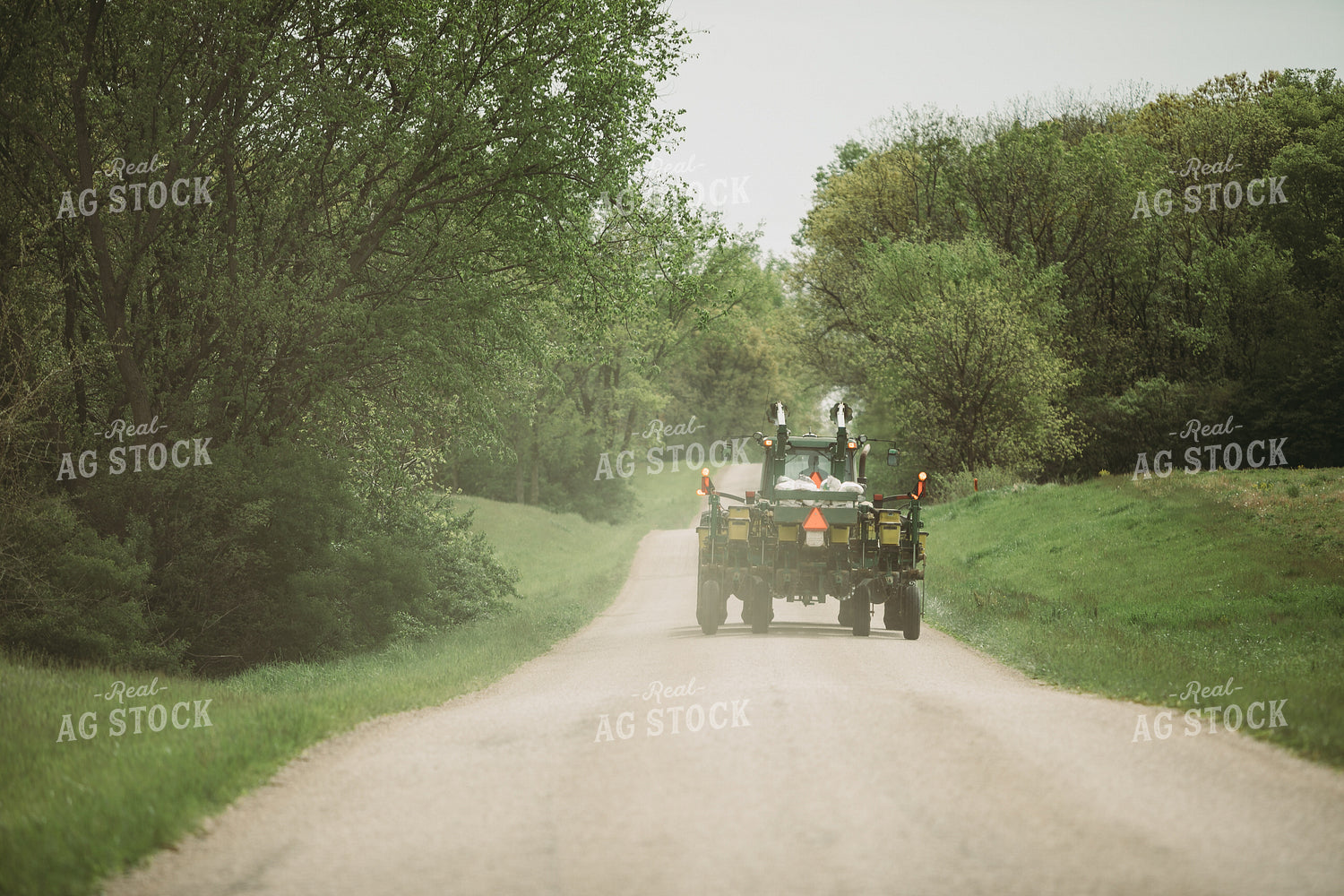 Tractor and Planter Driving Down Road 4012