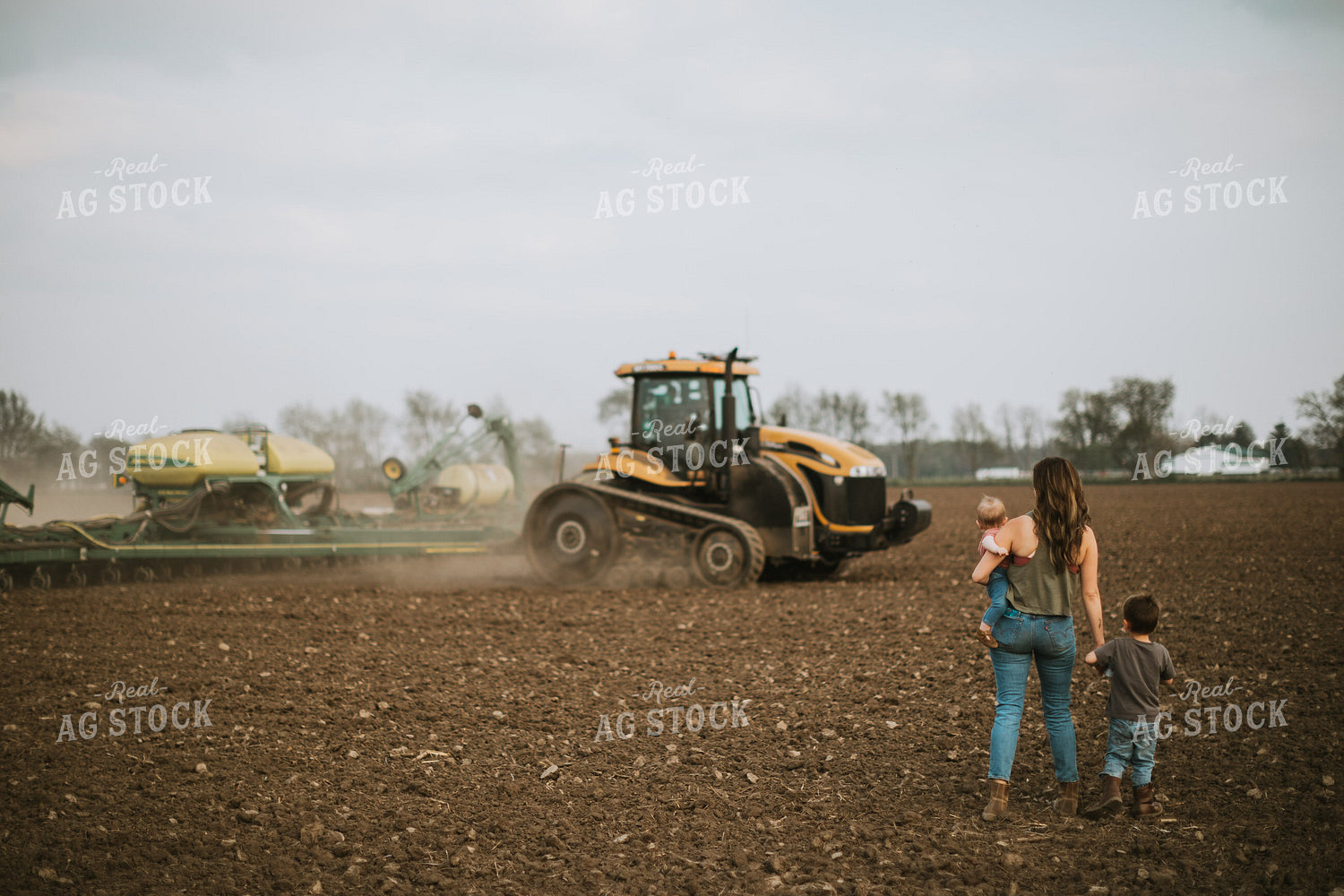 Farm Mom Taking Kids Out to Tractor During Planting 5637