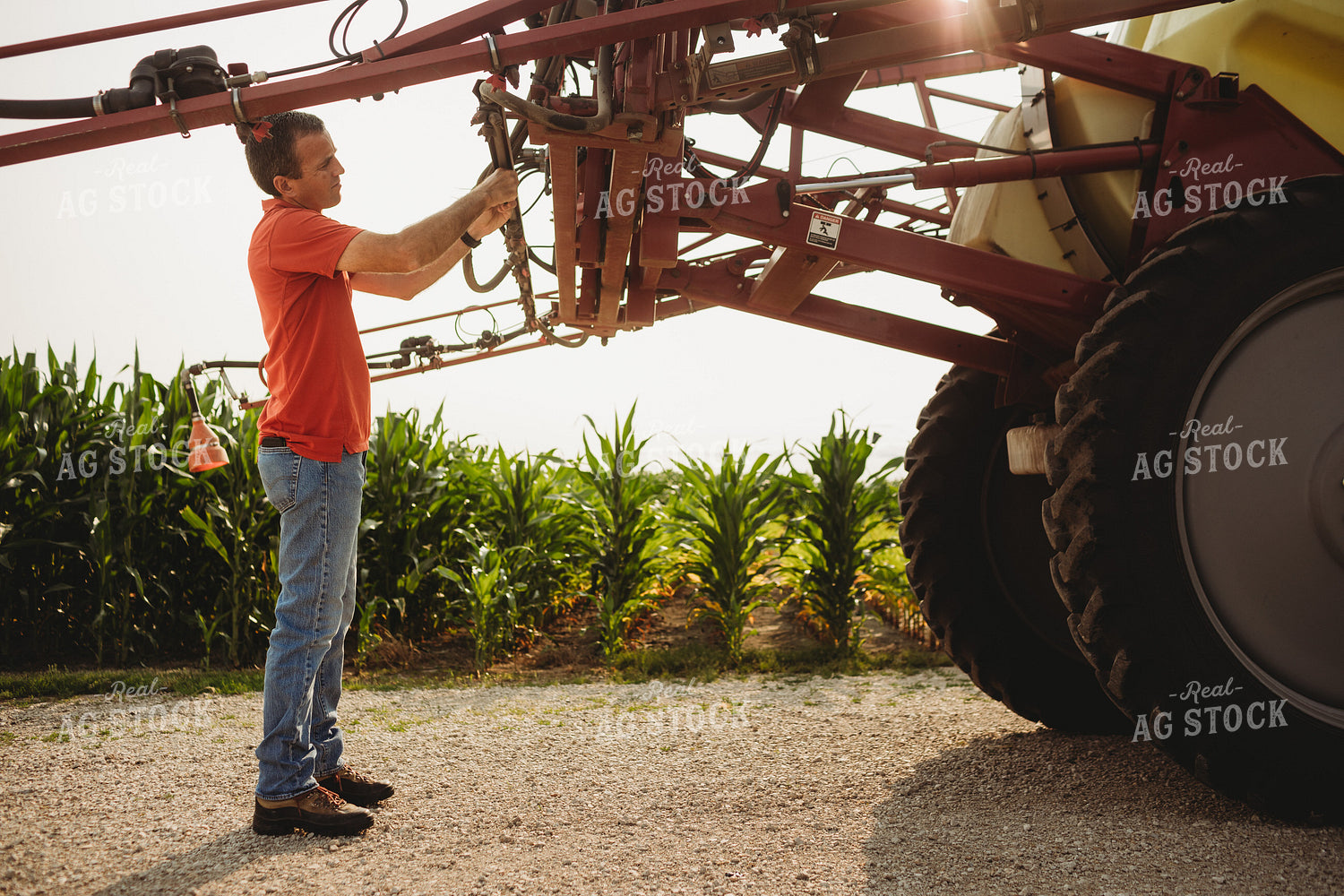 Farmer Checking Sprayer Nozzles 4448