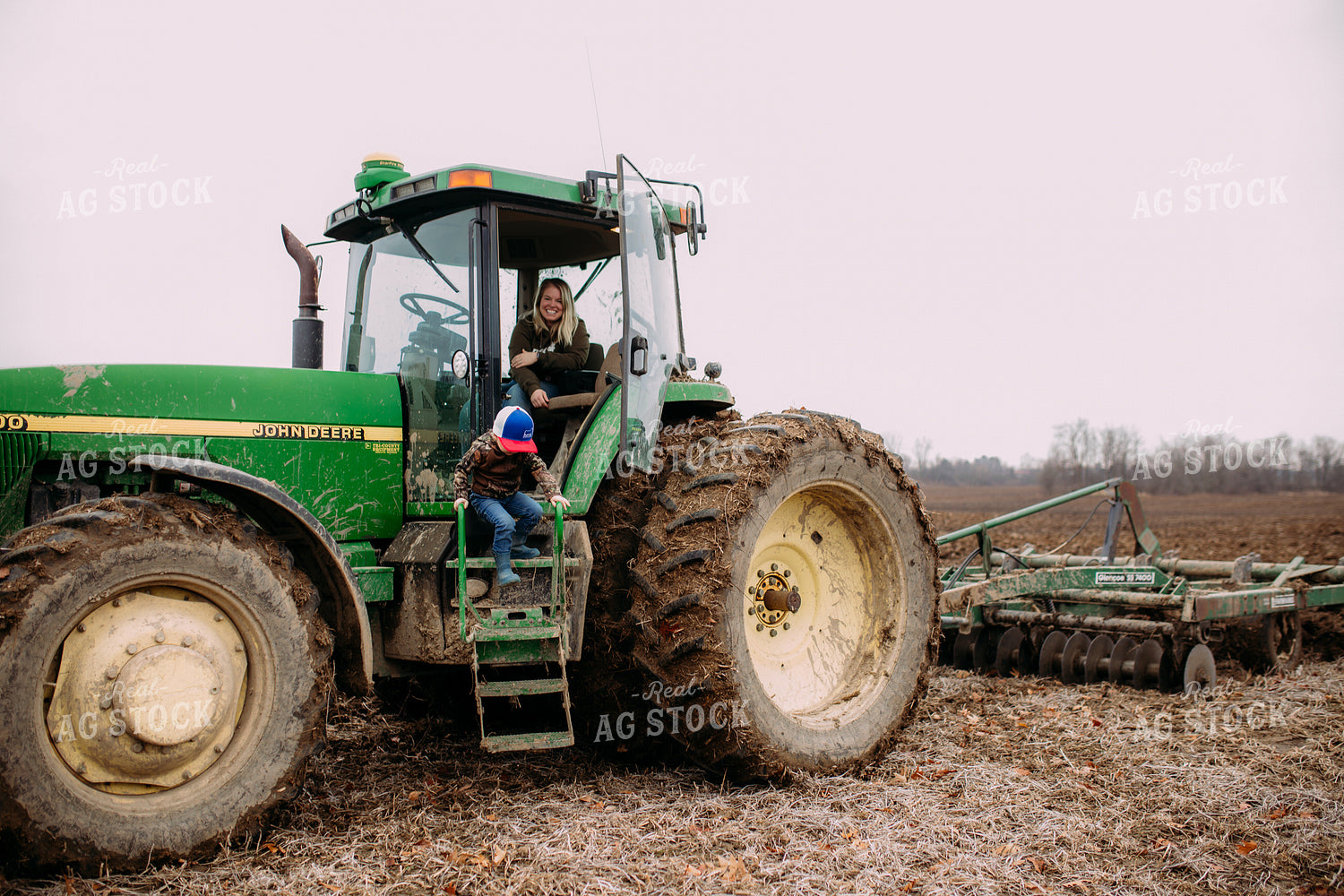 Farm Kid on Side of Tractor 169069