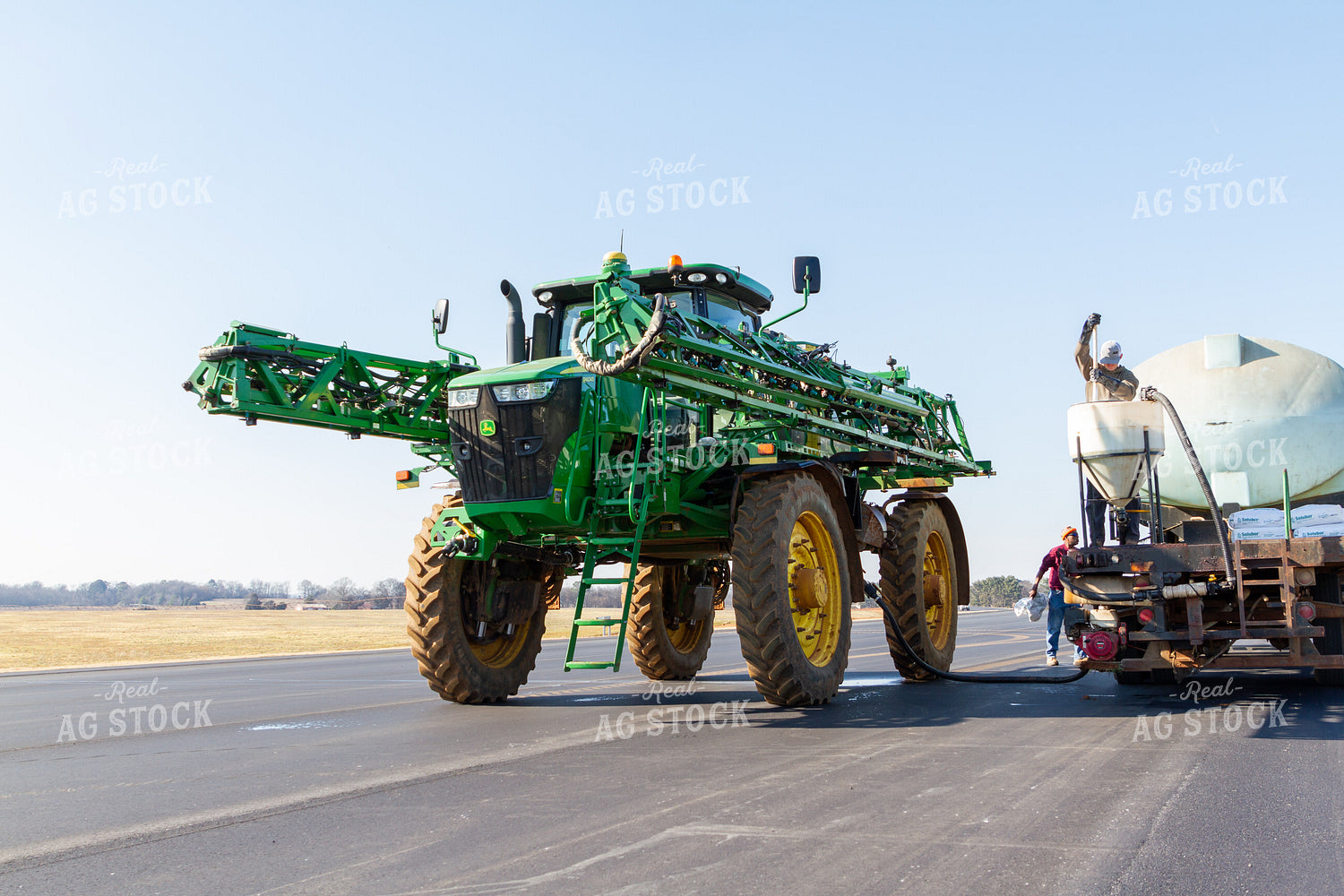 Sprayer Being Filled with Chemicals 79079