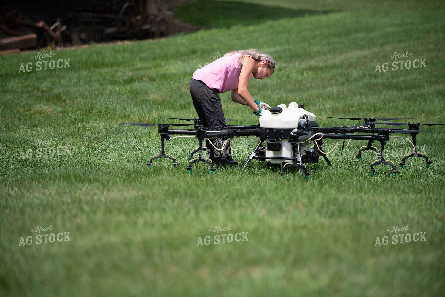 Female Pilot Preparing Drone for Fungicide Application 168073