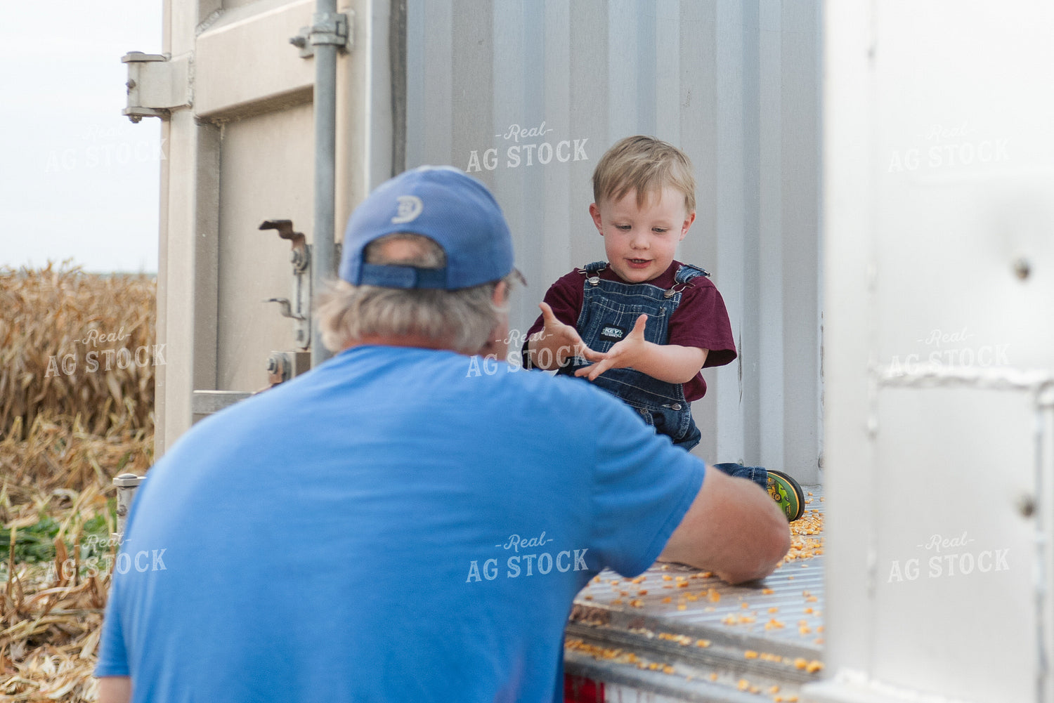 Farmer and Grandson in Field with Semi Truck 129071