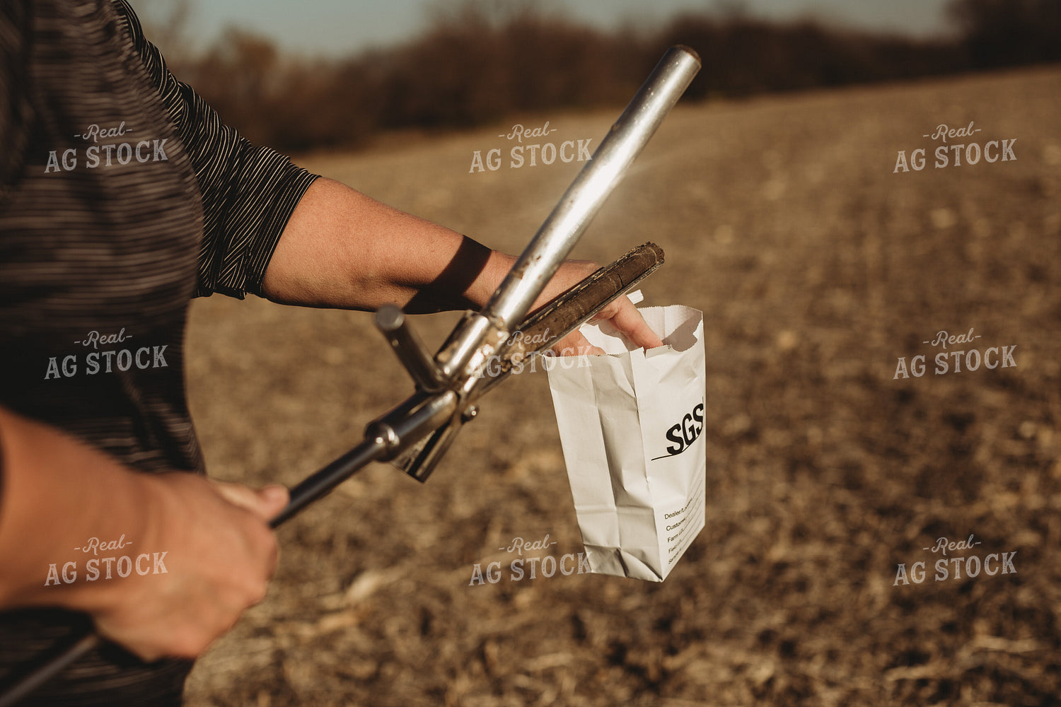 Farmer Opening Soil Sampling Probe with Soil Core 3713