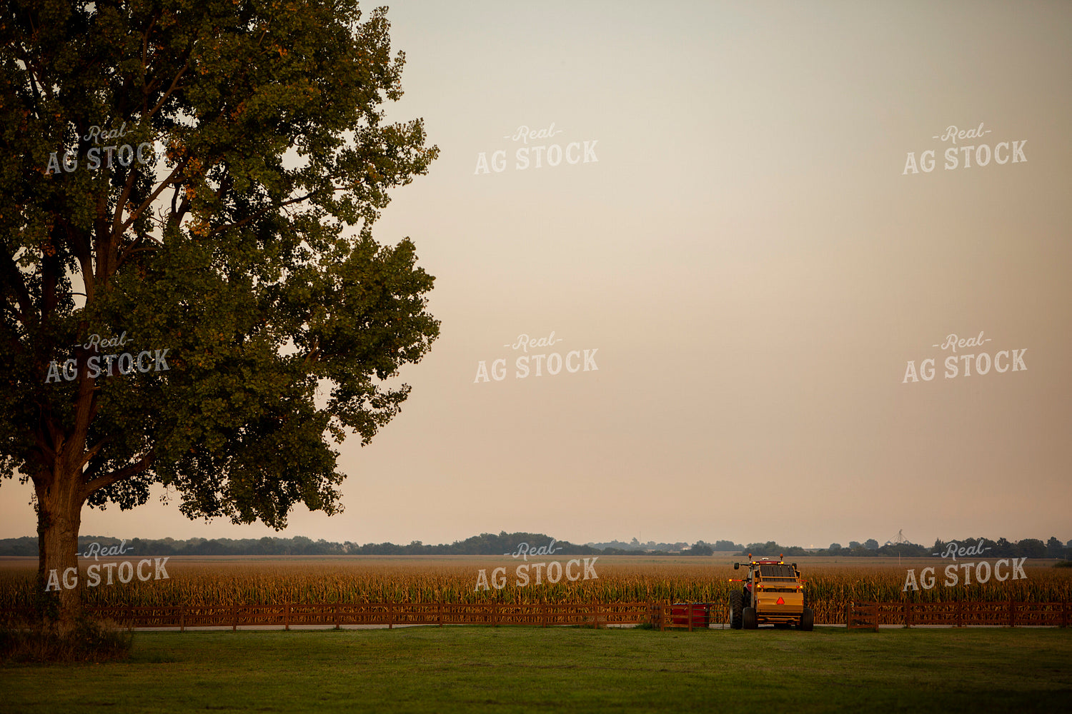 Tractor and Baler Exiting Field 5514