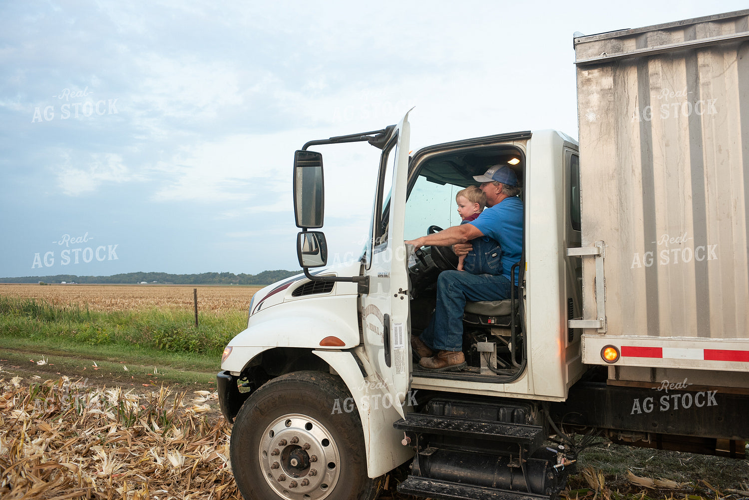 Farmer and Grandson in Field with Semi Truck 129074