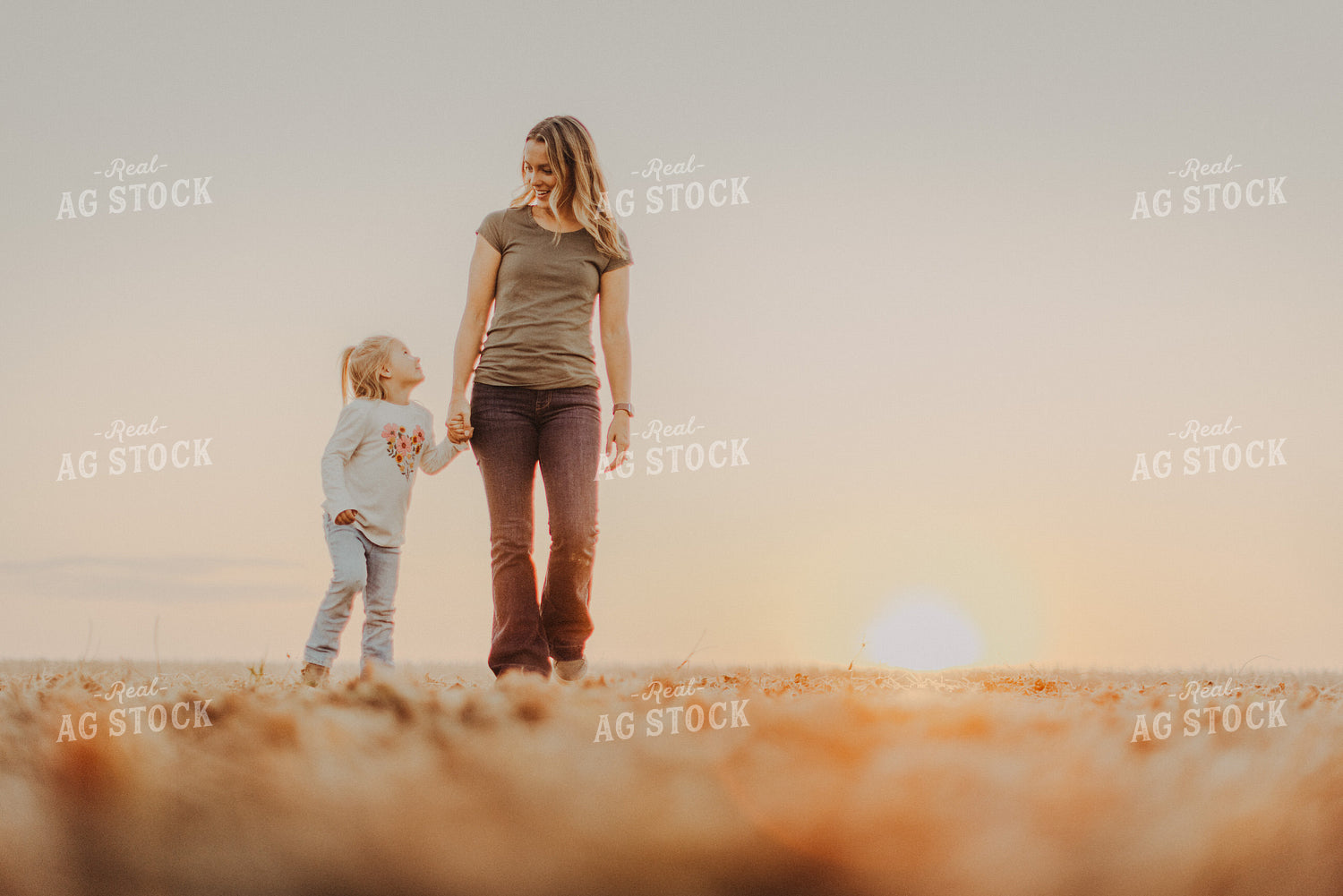 Farm Wife Walking with Daugher in Field 9270