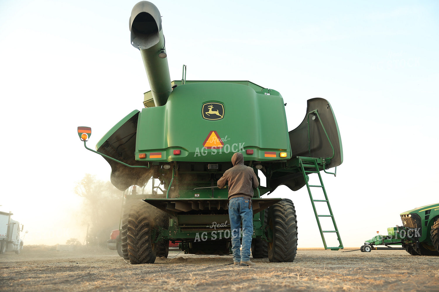 Farmer Blowing out Combine 114098