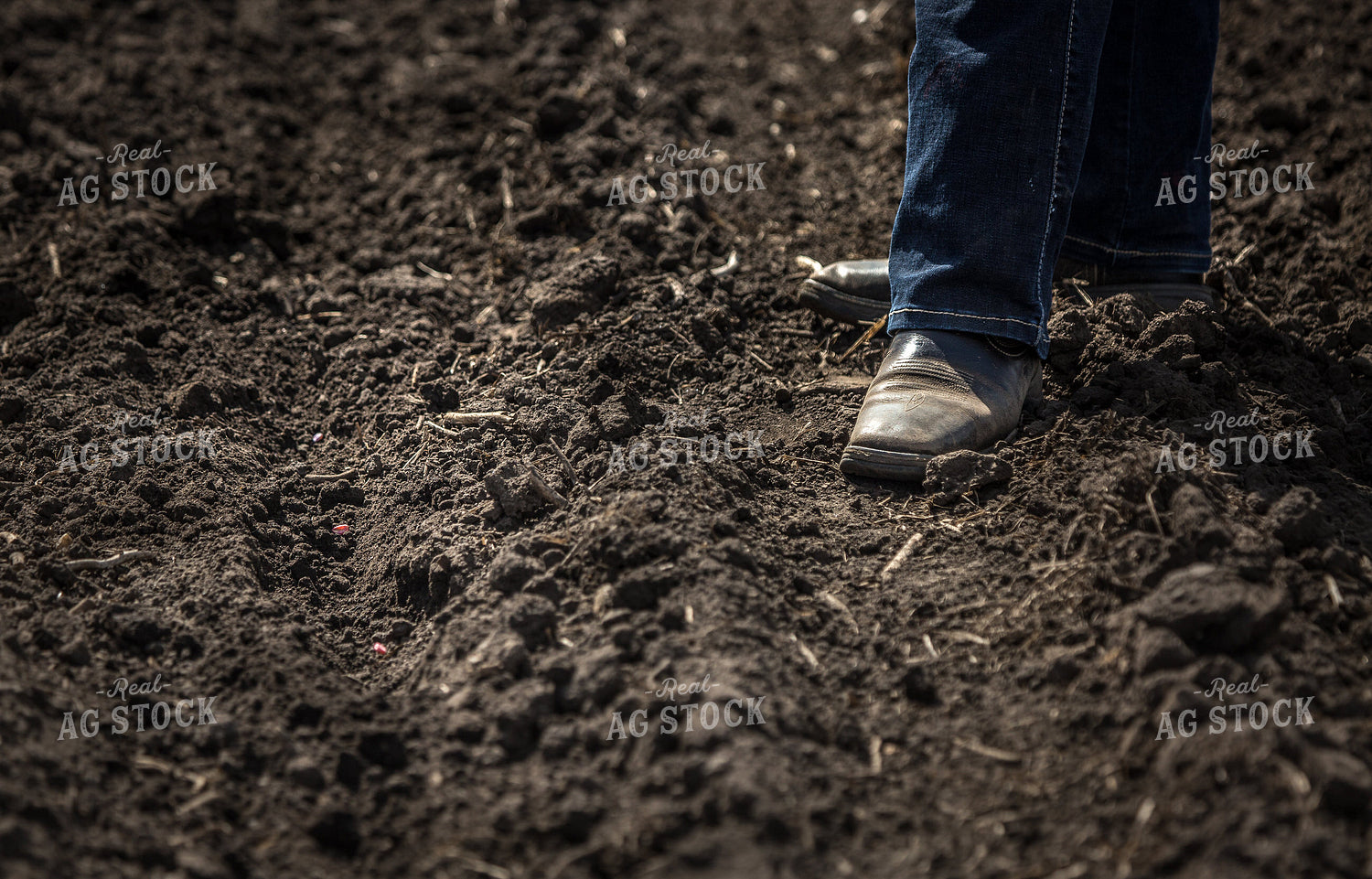 Farmer in Boots in Soil 161181