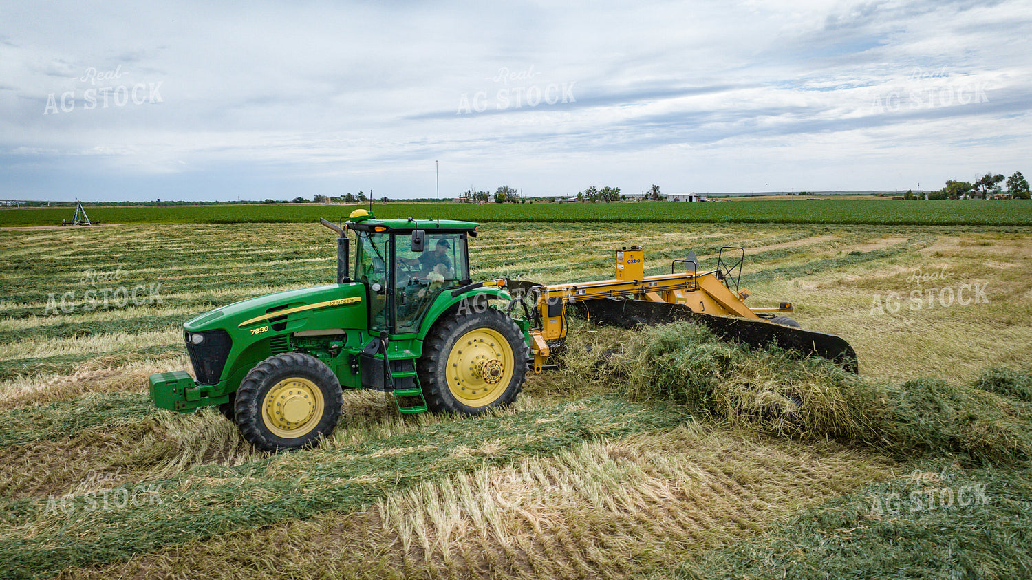 Tractor with Merger in Hay Field 56417