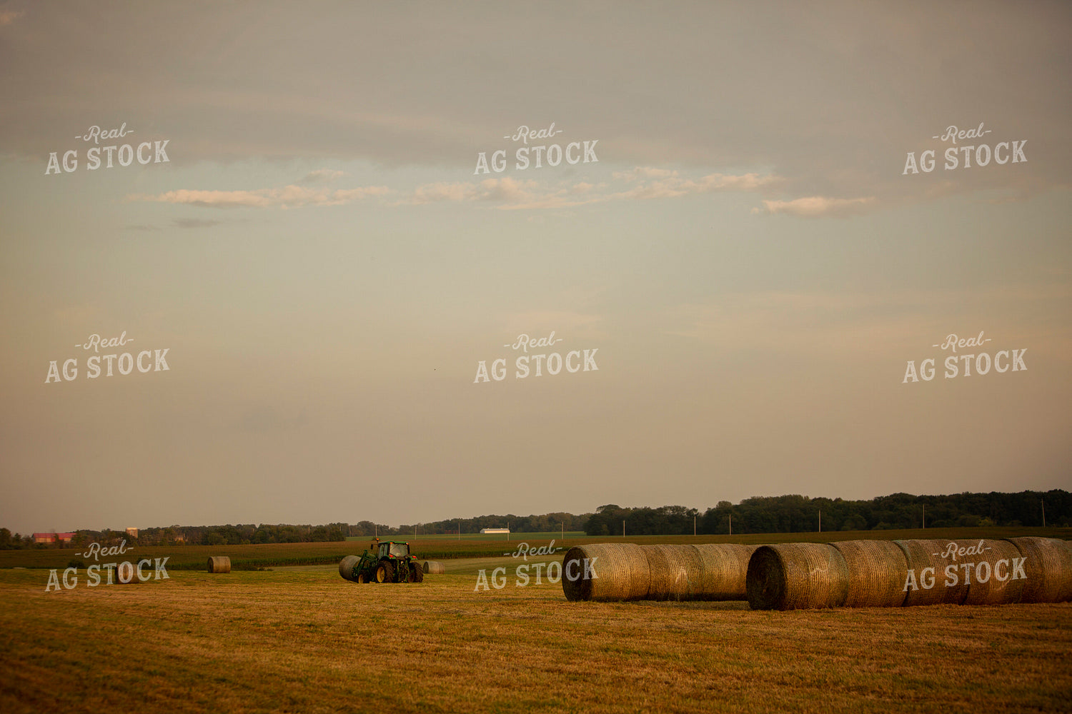 Tractor Lifting Round Hay Bale 5515